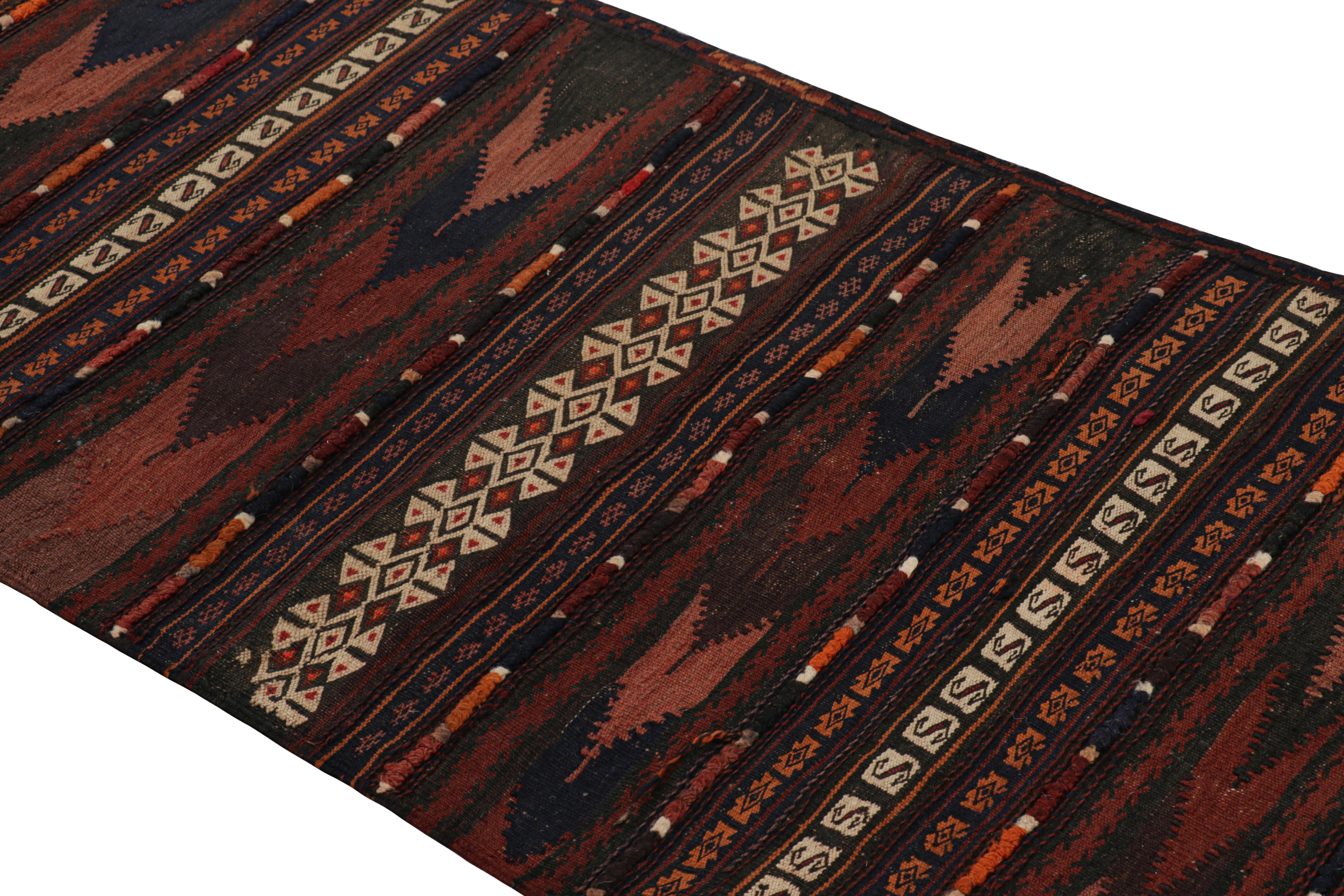 Handwoven in wool, this 2x10 modern geometric kilim runner rug represents a new line of tribal carpets in the Modern Classics Collection by Rug & Kilim. Each piece represents the work of women weavers in Afghanistan, preserving the rich tradition of