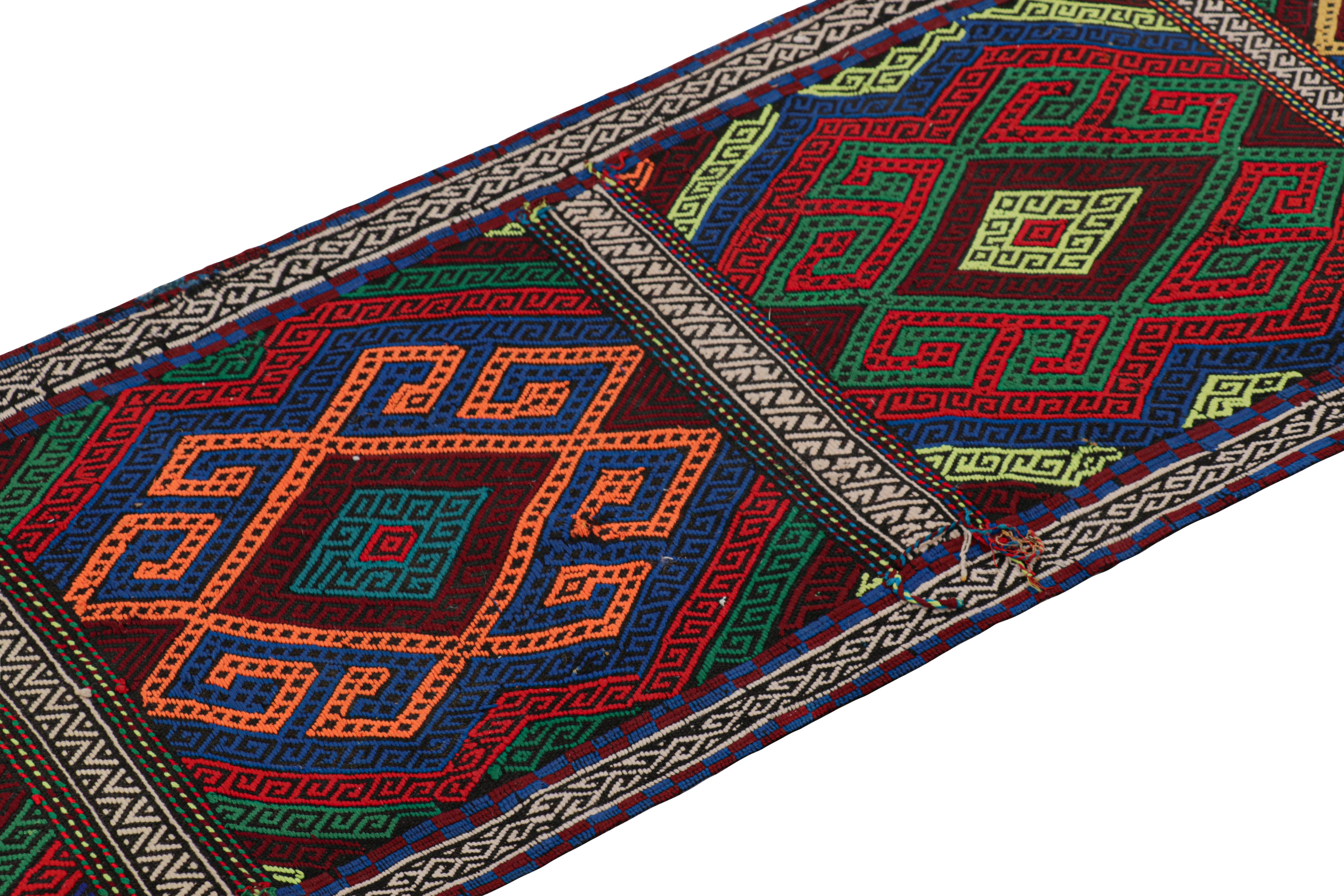Handwoven in wool, this 2x7 modern geometric kilim runner rug represents a new line of tribal carpets in the Modern Classics Collection by Rug & Kilim. Each piece represents the work of women weavers in Afghanistan, preserving the rich tradition of