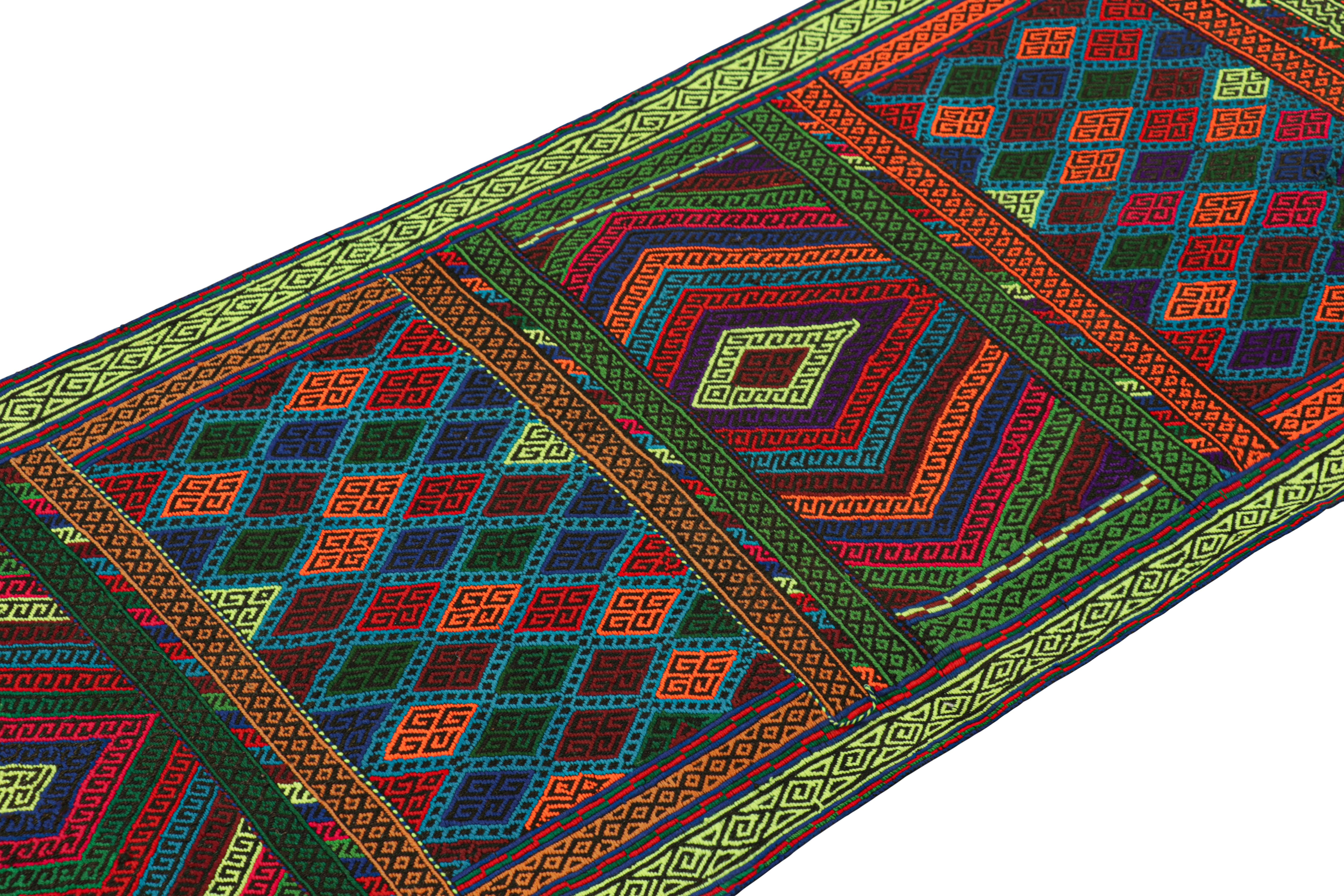 Handwoven in wool, this 2x5 modern geometric kilim runner rug represents a new line of tribal carpets in the Modern Classics Collection by Rug & Kilim. Each piece represents the work of women weavers in Afghanistan, preserving the rich tradition of