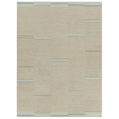 Rug & Kilim è un kilim contemporaneo a strisce beige, crema e blu.