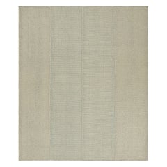 Rug
Kilim è un kilim contemporaneo a strisce color crema, beige e blu.