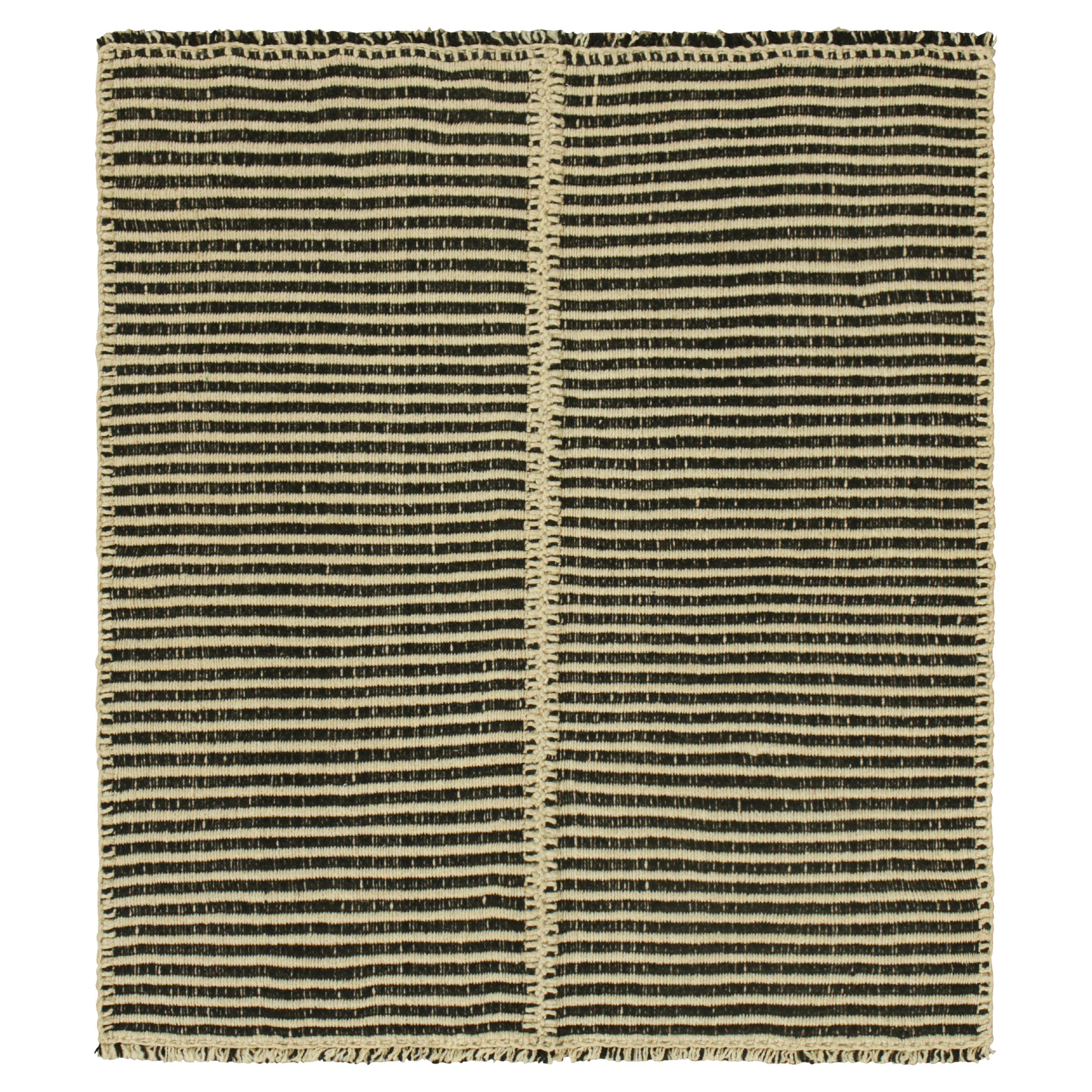 Rug & Kilim’s Contemporary Kilim with Textural Cream White and Black Stripes