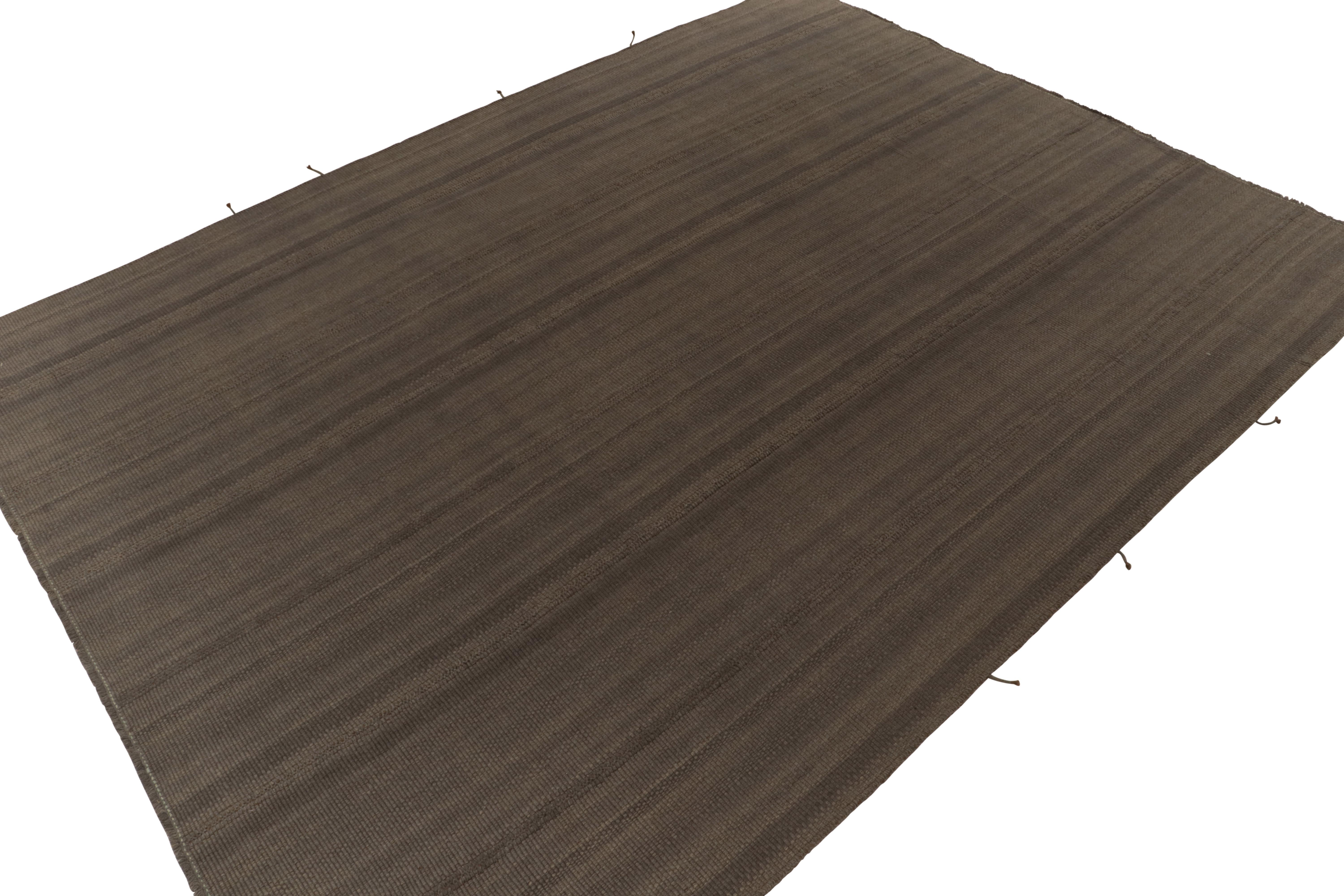 Handwoven in wool, a 10x15 Kilim from a bold, artisan line of contemporary flatweaves by Rug & Kilim.

On the Design: Fondly called the “Rez Kilim”line, the piece enjoys a more durable take on classic panel-woven style in rich brown hues. Keen eyes