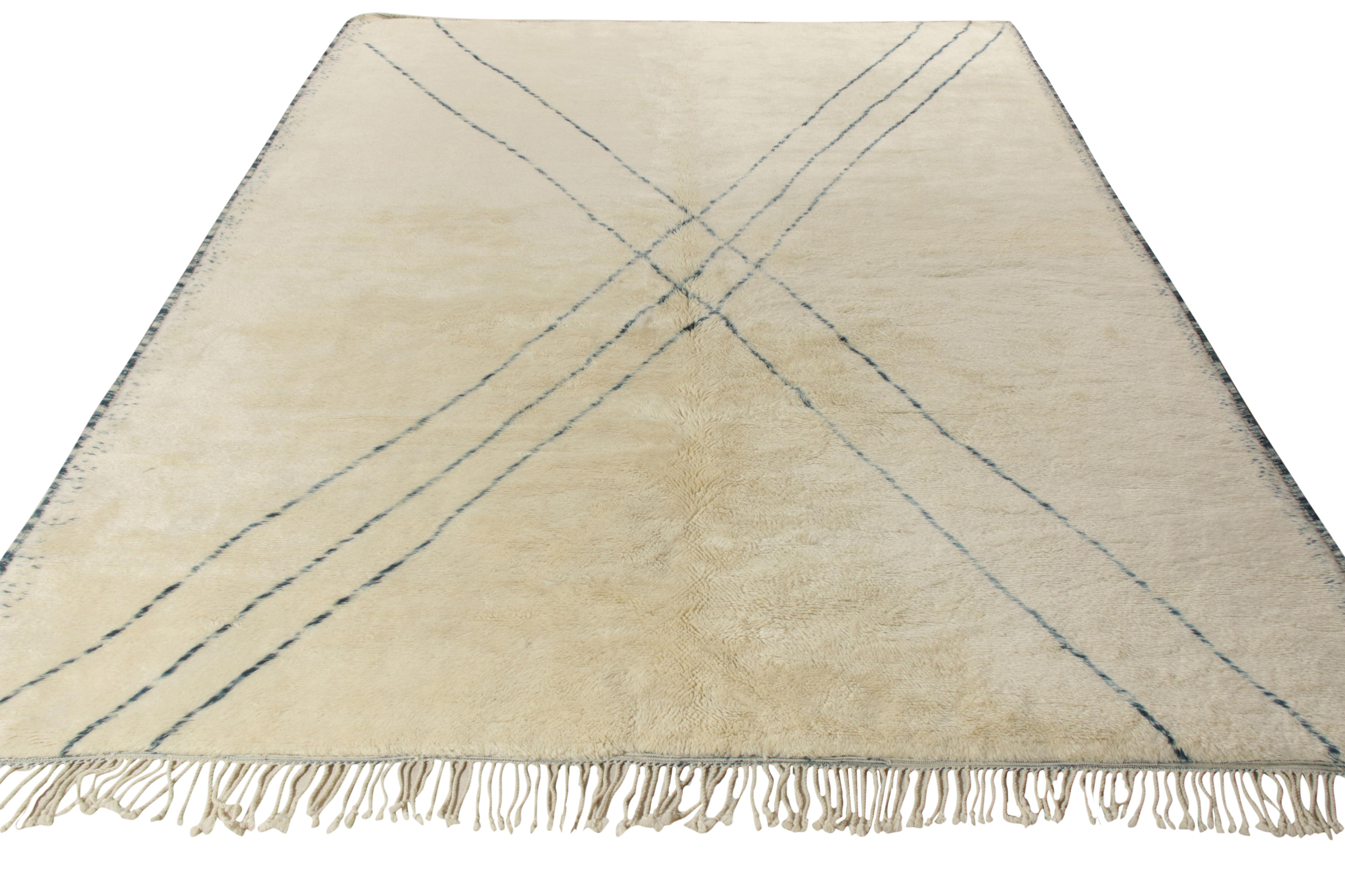 Hand knotted in luxe quality yarn, this 10x13 piece hails from contemporary additions to Rug & Kilim’s Moroccan rug collection. While the field flourishes in the exuberance of a creamy beige-white colourway, the rug enjoys a sophisticated look in a