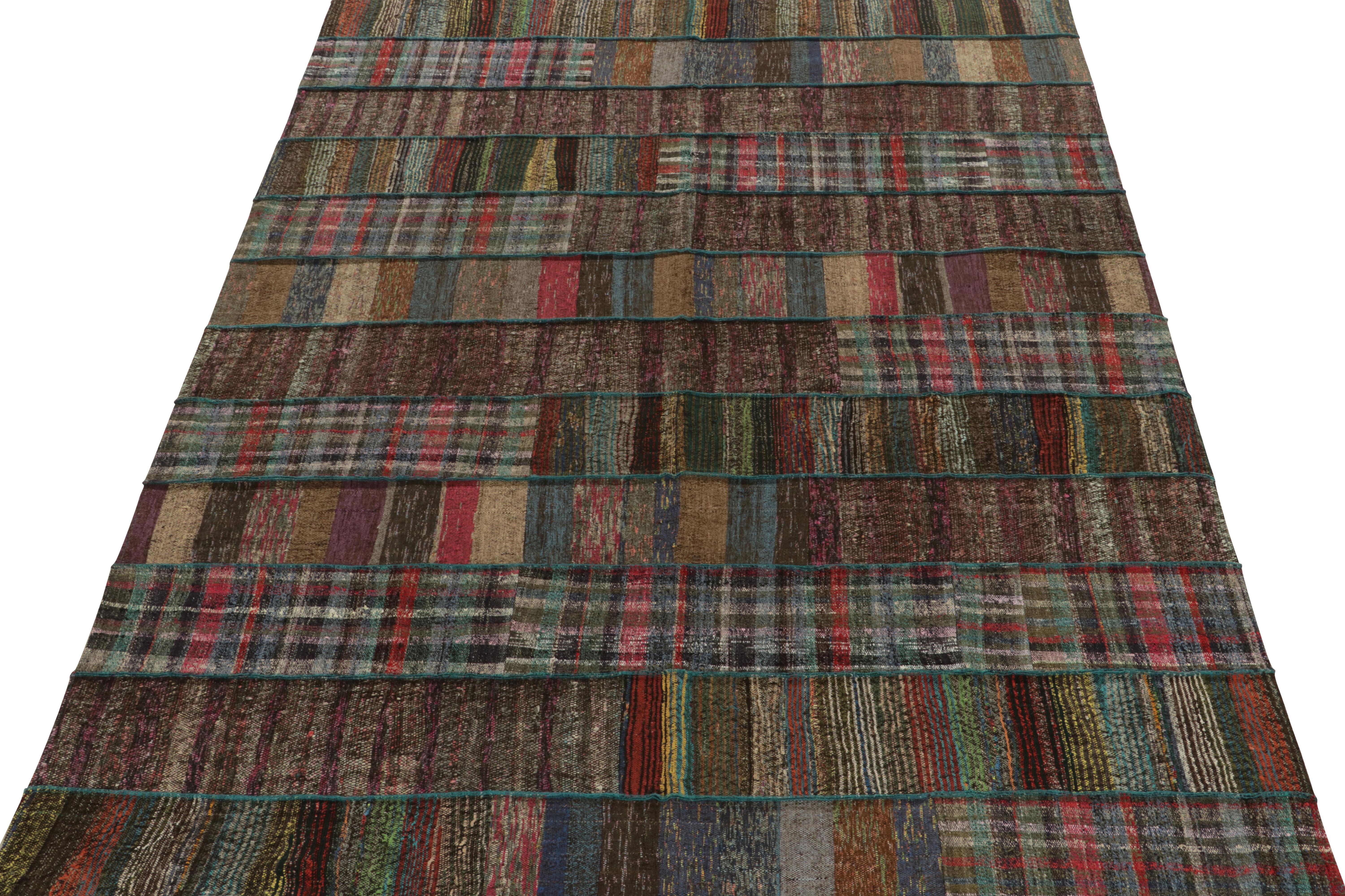 Rug & Kilim takes pride in presenting its artistic vision of patchwork kilim that reimagines vintage yarns into unique pieces of art. This 7x10 flatweave features a striated pattern that lends a smooth sense of movement in variegated shades across