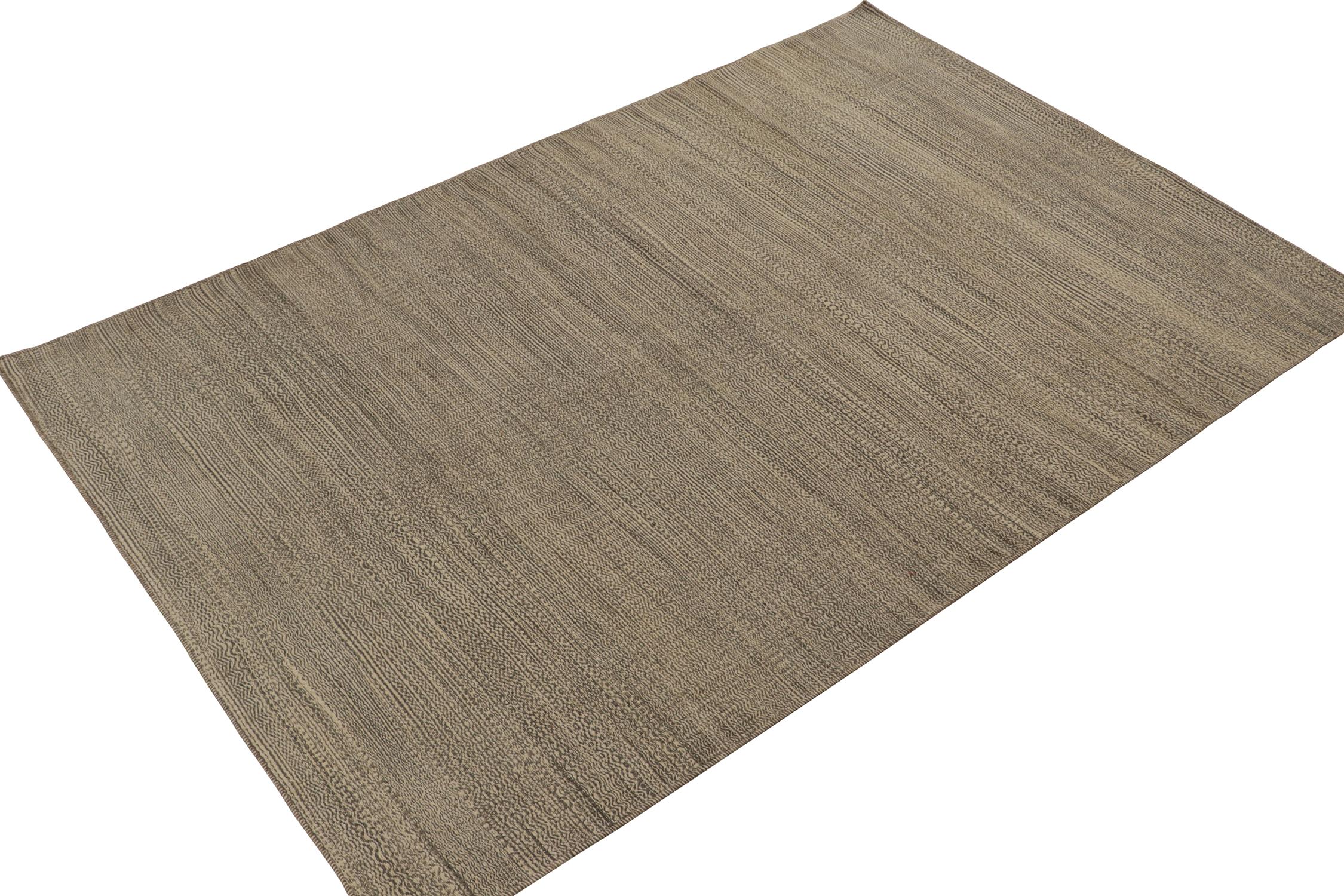 Handwoven in wool, a 6x10 contemporary Persian Kilim from Rug & Kilim newest line of innovative flat weave rugs.

This design marks an inventive take on texture and striae technique, enjoying a comfortable play of beige-brown tones. Deeper