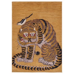 Rug
Kilim è un tappeto pittorico contemporaneo con disegno di tigri in oro e nero.