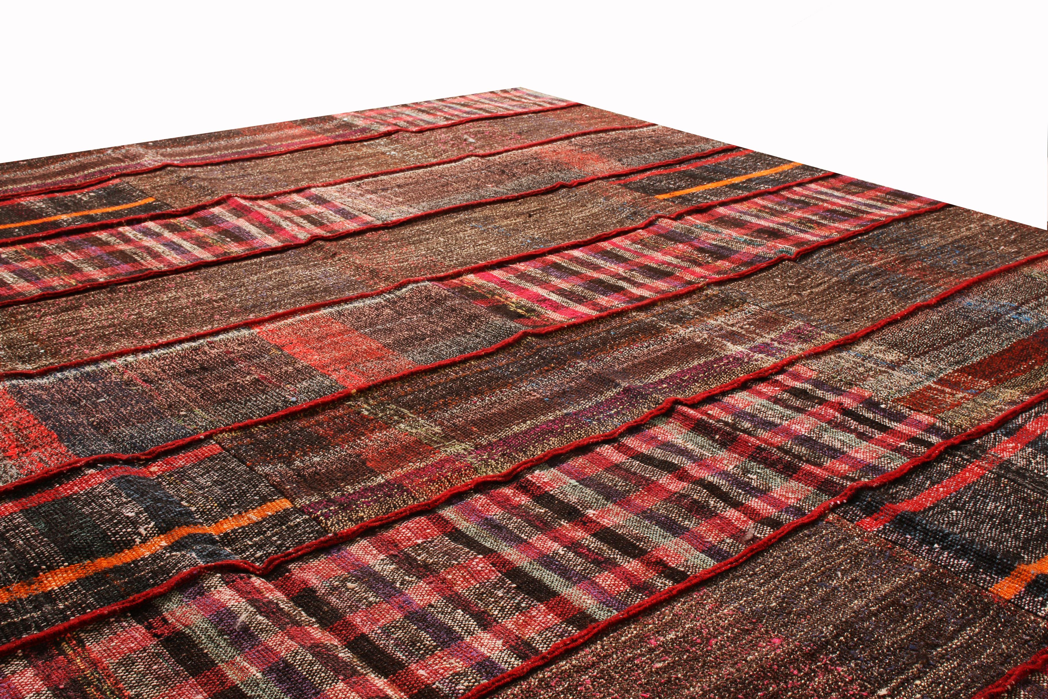 Originating from Turkey, Rug & Kilim's contemporary wool Kilim rug is inspired from a distinct family of traditional families, woven with a mixture of patchwork aesthetic and column-based pattern. Bright and rich arrays of red, with notes of purple,