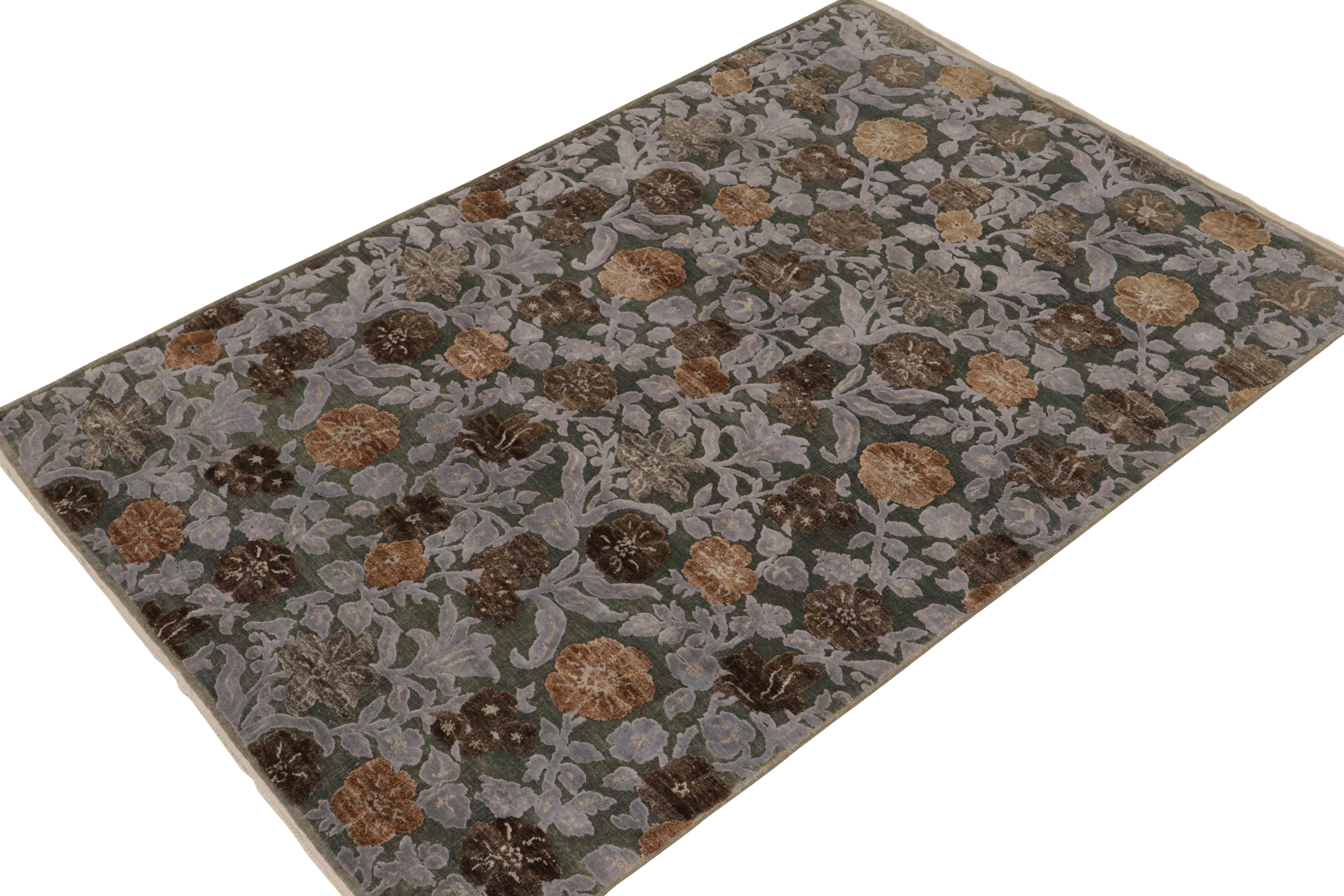 Hand-knotted in a fine blend of wool & silk, this 6x10 contemporary rug from our New & Modern collection is uniquely inspired by classic European styles. Gorgeous floral patterns in beige-brown & blue tones enjoy a high-low textural element in play
