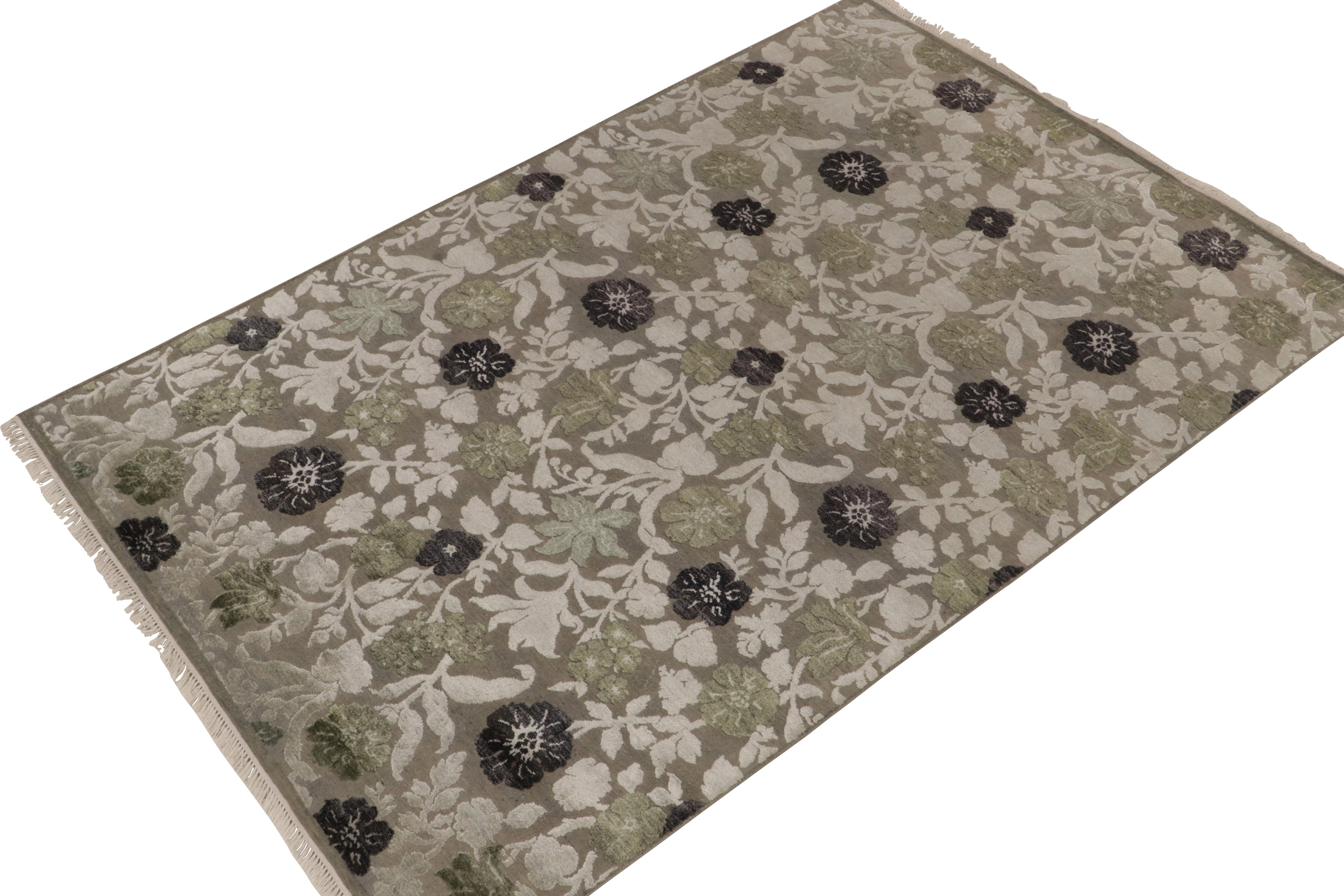 Hand-knotted in a fine blend of wool & silk, this 6x9 contemporary rug from our New & Modern collection is uniquely inspired by classic European styles. Floral patterns in creamy beige, green and black enjoy a high-low textural element of tasteful