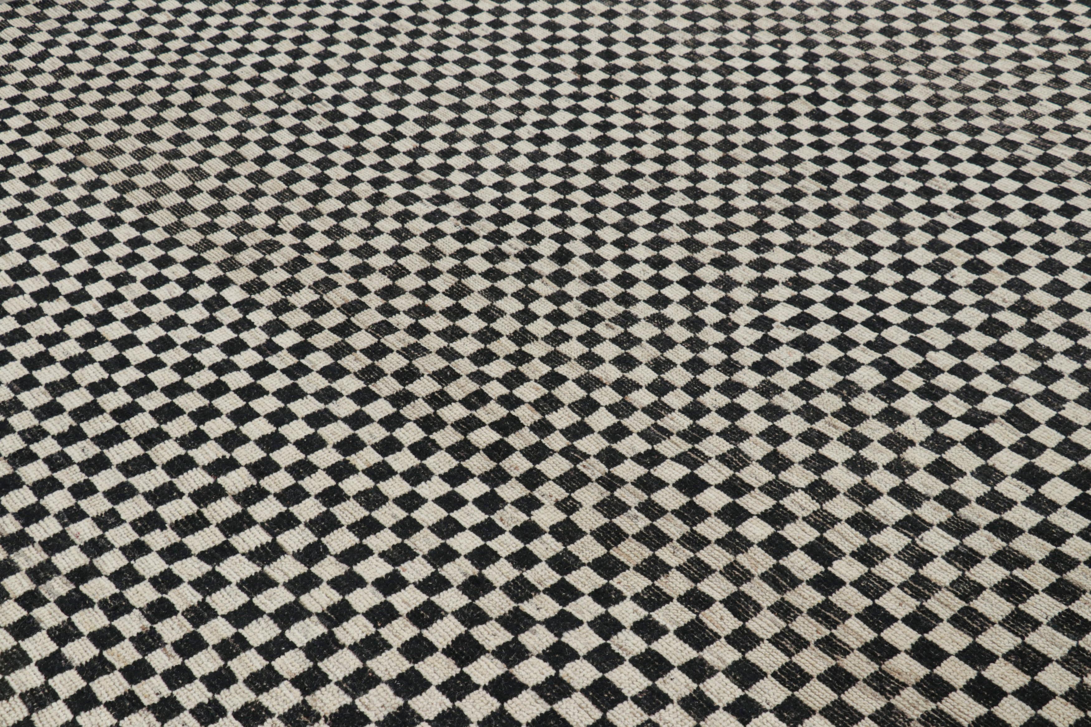 Made with hand-knotted wool, this 8x10 contemporary rug is an exciting new addition to the Modern rug collection by Rug & Kilim, with a playful use of positive-negative in its colors and geometry.

On the Design: 

Cream white and black tones