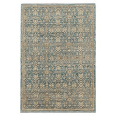 Alfombra contemporánea Rug & Kilim en azul con motivos florales beige-marrón