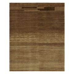 Rug 
Kilim è un tappeto contemporaneo nei toni del marrone e del taupe con strisce e striature