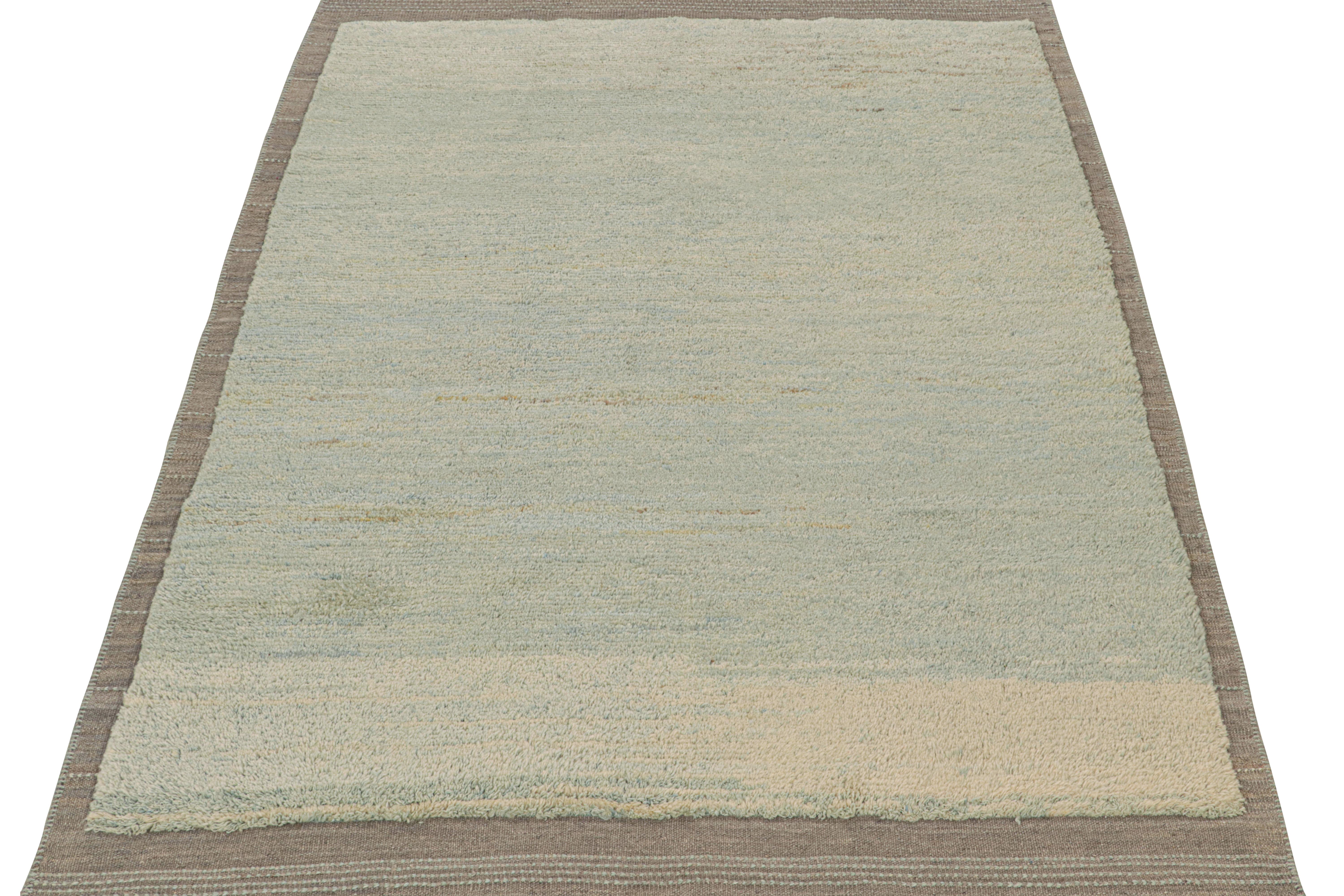 Handwoven in wool, a 6x8 piece is from a bold new line of contemporary rugs by Rug & Kilim.

Further On the Design:

This new addition to “Rez Kilim” is a play of pile and flat weave together, as seen in the sky blue field and gray border.
