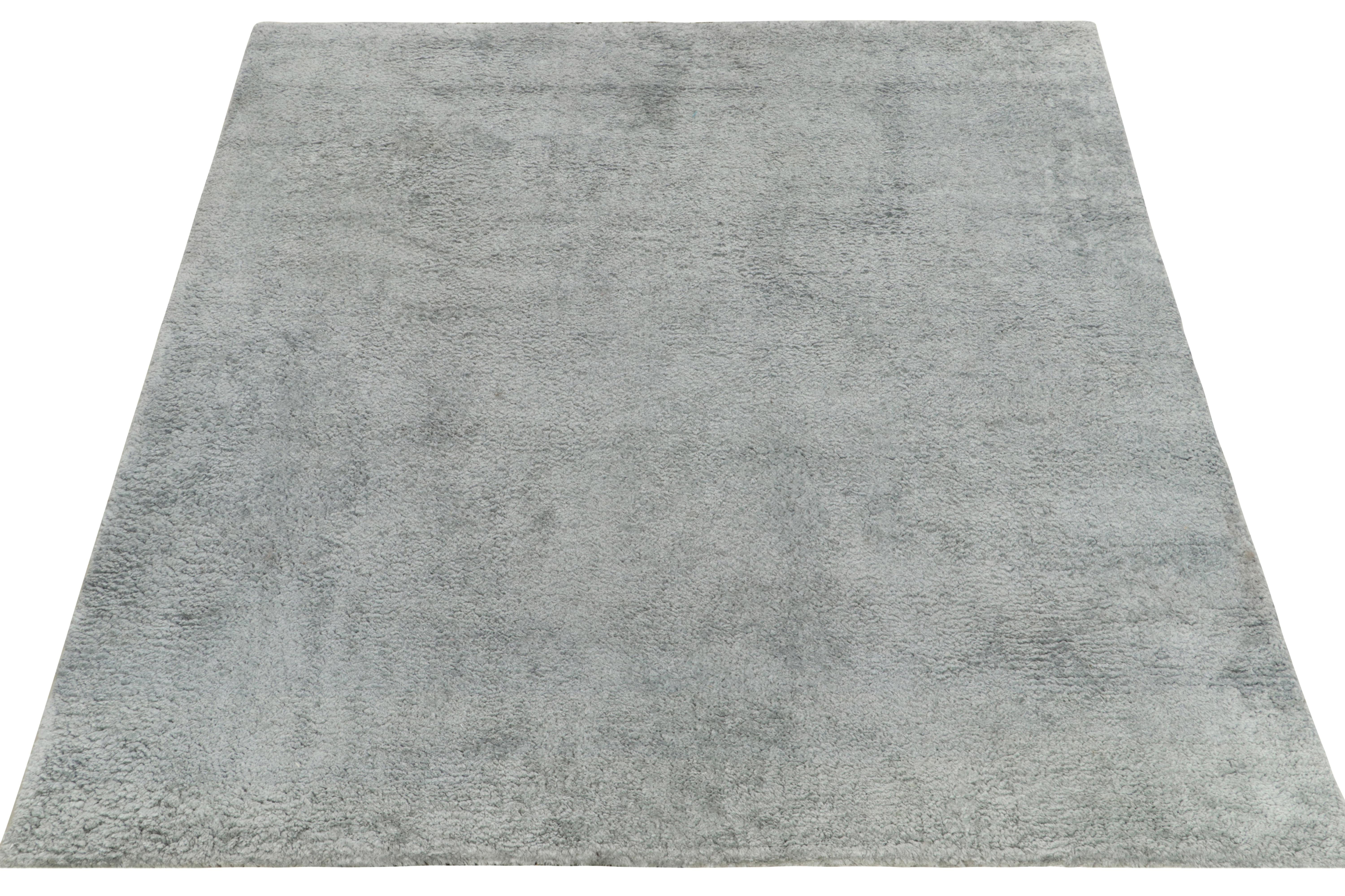 Hailing from Rug & Kilim’s Texture of Color collection, this 7x8 rug highlights our principal Josh’s passion for innovating tone-on-tone, patternless patterns in luxury rugs. Hand knotted in silk, the shag pile flourishes in a rich solid gray-blue