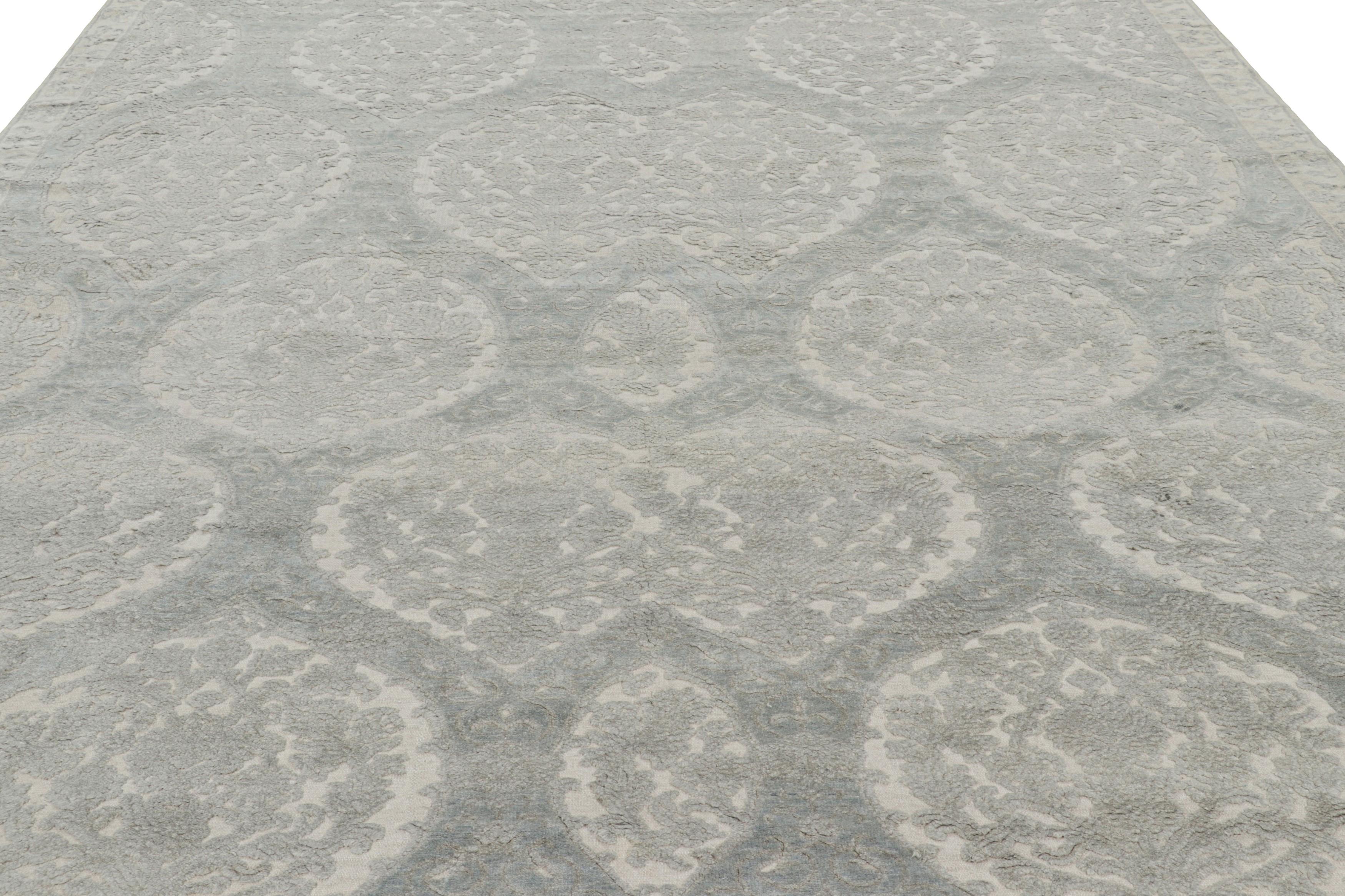 Made with hand-knotted wool and silk, this 10x13 rug is an exciting addition to Rug & Kilim’s Modern Classics collection. 

On the Design: 

This piece features high-and-low textures married to silver-gray floral patterns in all over style. Admirers