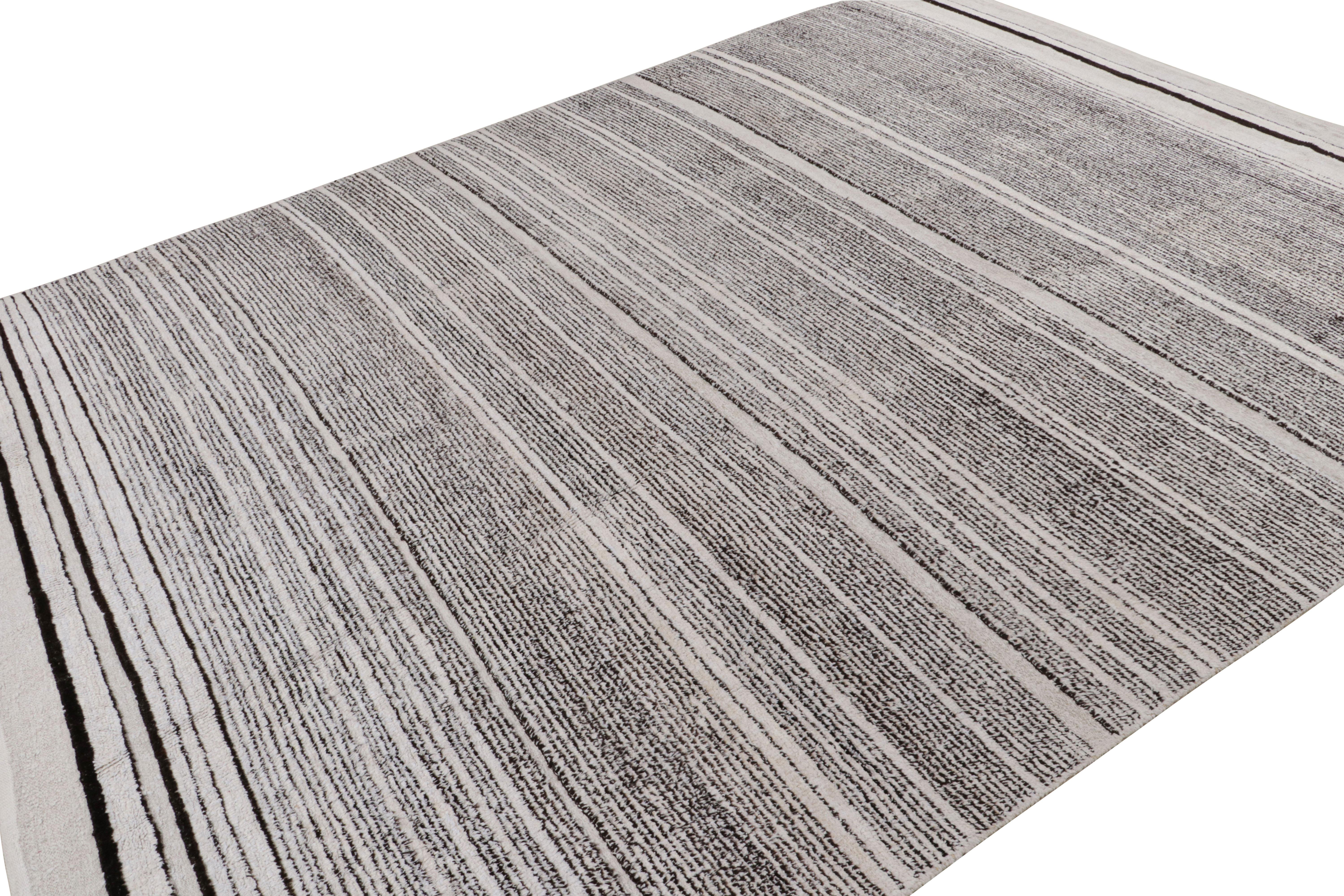 Hand knotted in wool, this 9x12 contemporary rug “Sky” features geometric stripes, and is more emphatic of the gradation theme. 

On the Design:

Admirers of the craft and keen eyes will note a take on gradation in this piece—a subtle yet tasteful