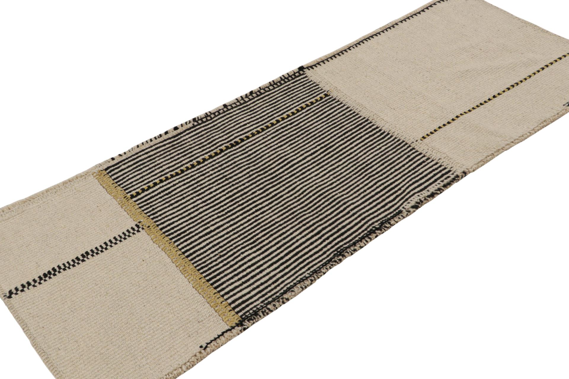 Handwoven in wool, a 2x6 runner Kilim in black and beige/brown tones, from a bold new line of contemporary flatweaves, ‘Rez Kilim’, by Rug & Kilim.

On the Design: 

Connoting a modern take on classic panel-weaving, our latest “Rez Kilim” enjoys