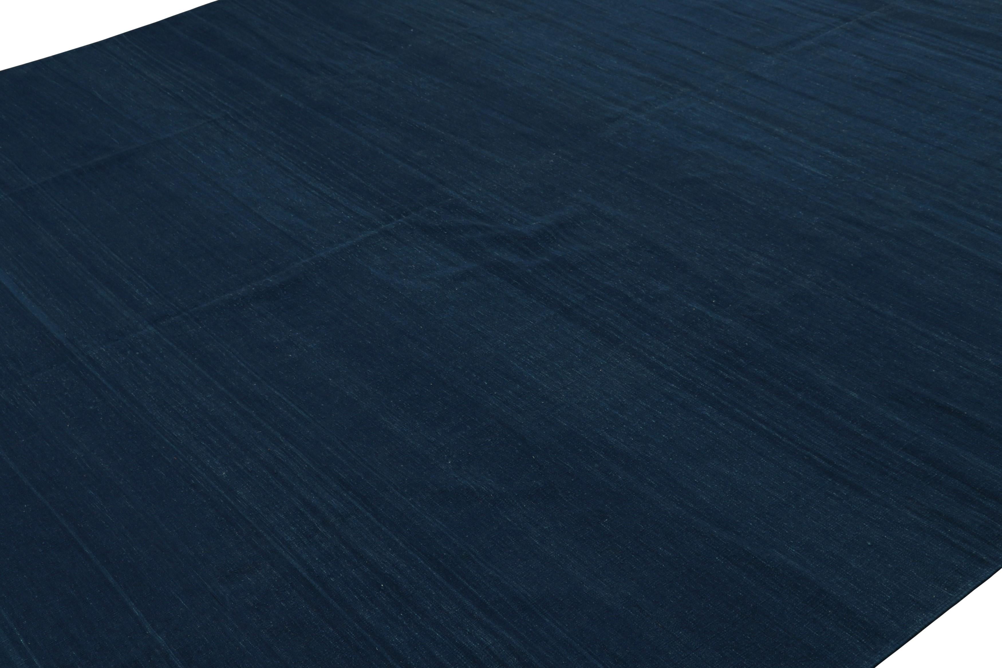 Made with handwoven cotton, this contemporary 9x11 Dhurrie flat weave is an exciting new entry in Rug & Kilim’s esteemed collection.  

On the Design: 

Representing a modern take on antique and vintage Dhurrie flatweaves, this rug has been made by