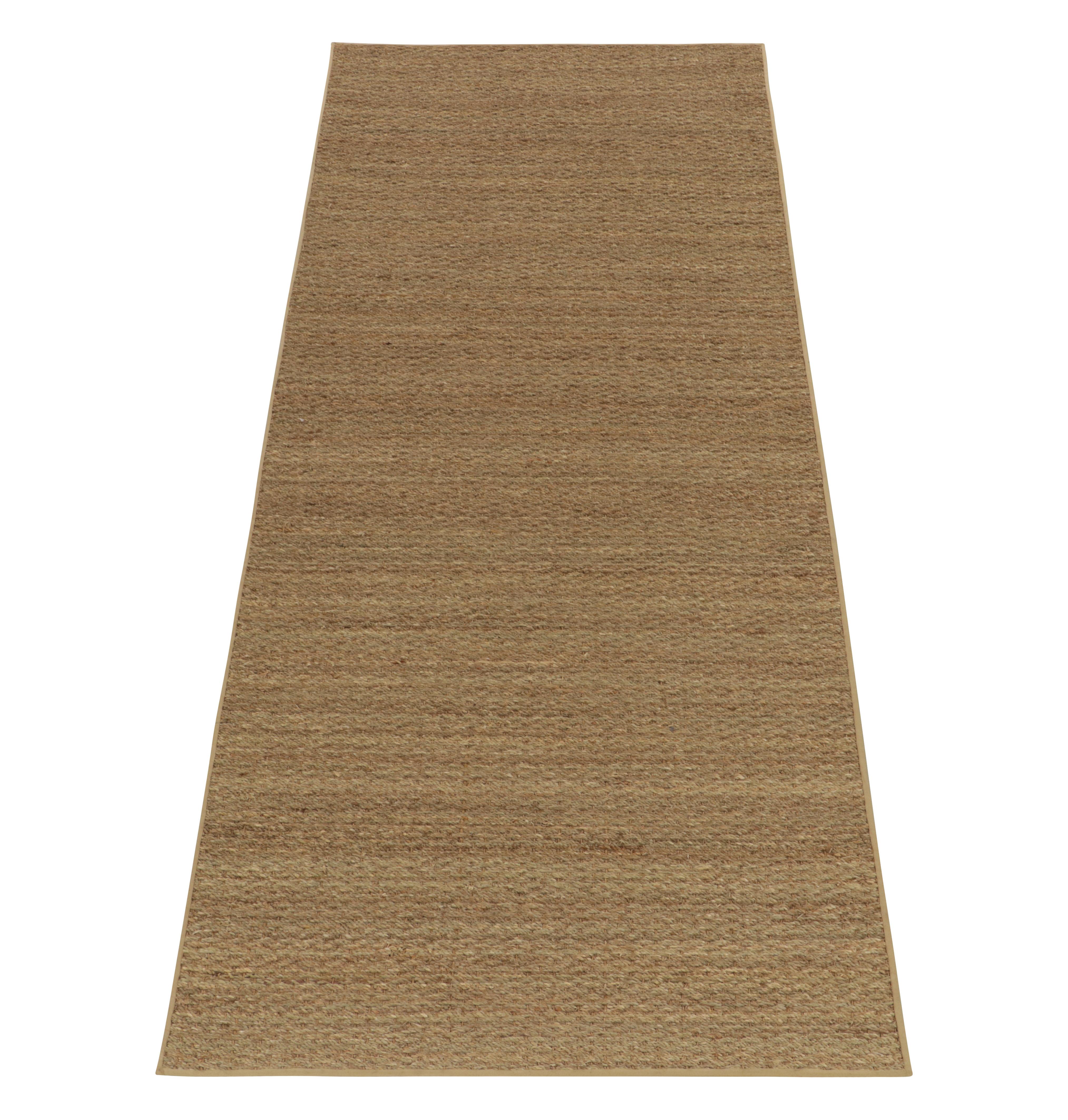 Crafted with hemp,a 3x9 runner from Rug & Kilim’s contemporary selections. Exemplified in this 3x9 scale, the vision amplifies the refreshing earthiness of the collection with solid beige-brown tones for an alluring earthy appeal in modern style.