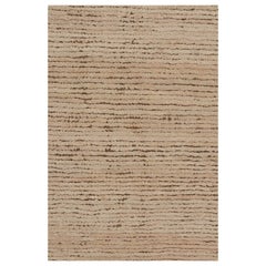 Rug & Kilim è un tappeto contemporaneo dai toni rosa e beige-marrone