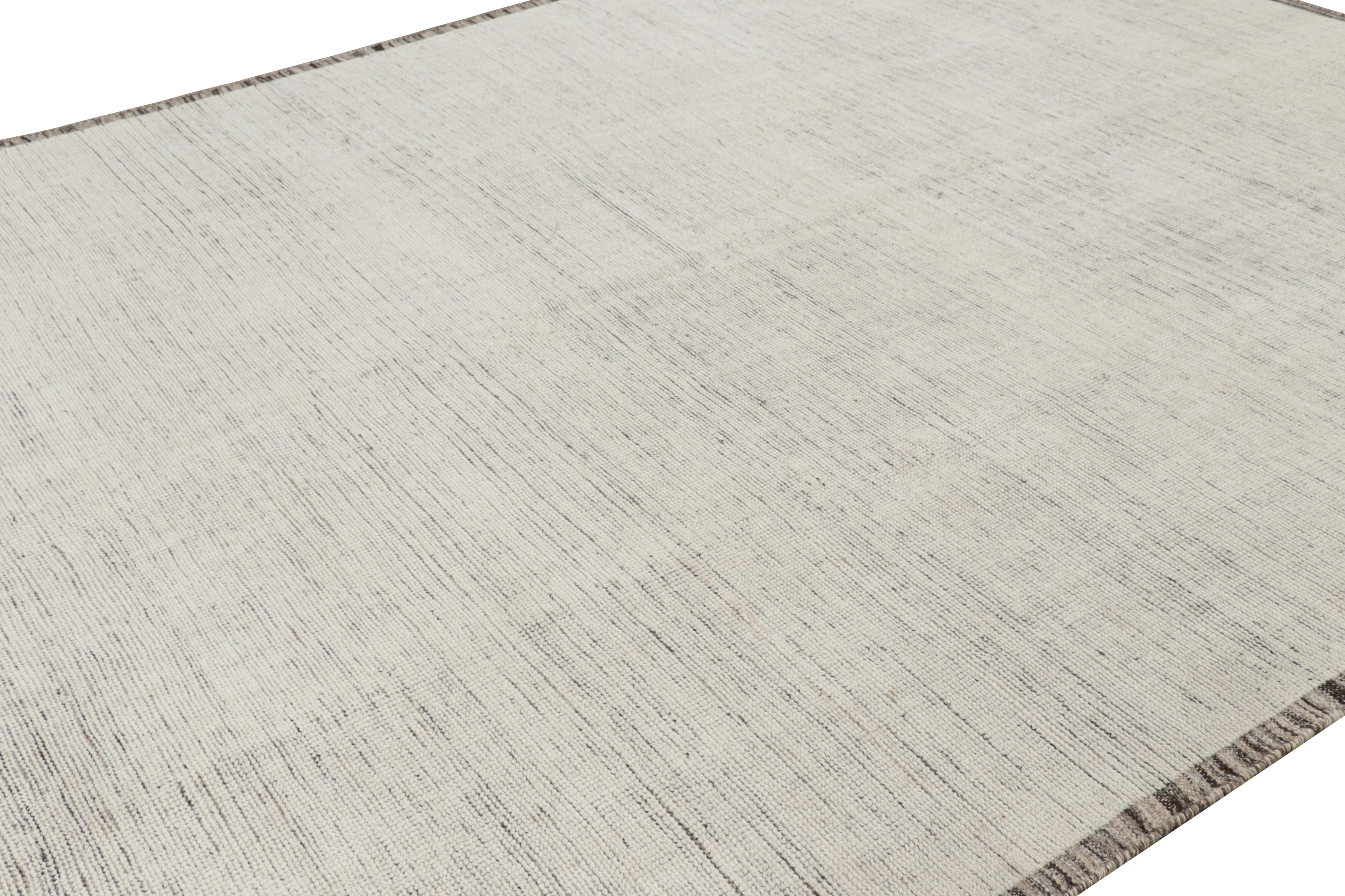 Hand-knotted in wool, this 10x14 contemporary rug is an exciting new addition to Rug & Kilim’s Textural collection, with an impressive use of a humble palette in its unique play on stripes, striae, and the subtlety of monochromatic rugs.

On the