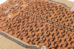 Rug & Kilim’s Contemporary Tiger Rug in Gold with Brown and Orange Pictorial