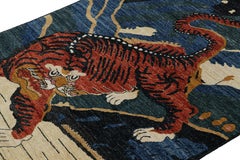 Rug & Kilim’s Contemporary Tiger Rug with Navy Blue and Orange Pictorials