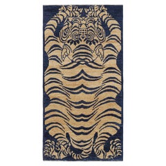 Rug & Kilim’s Contemporary Tiger Skin Rug in Navy Blue with Gold Pictorial