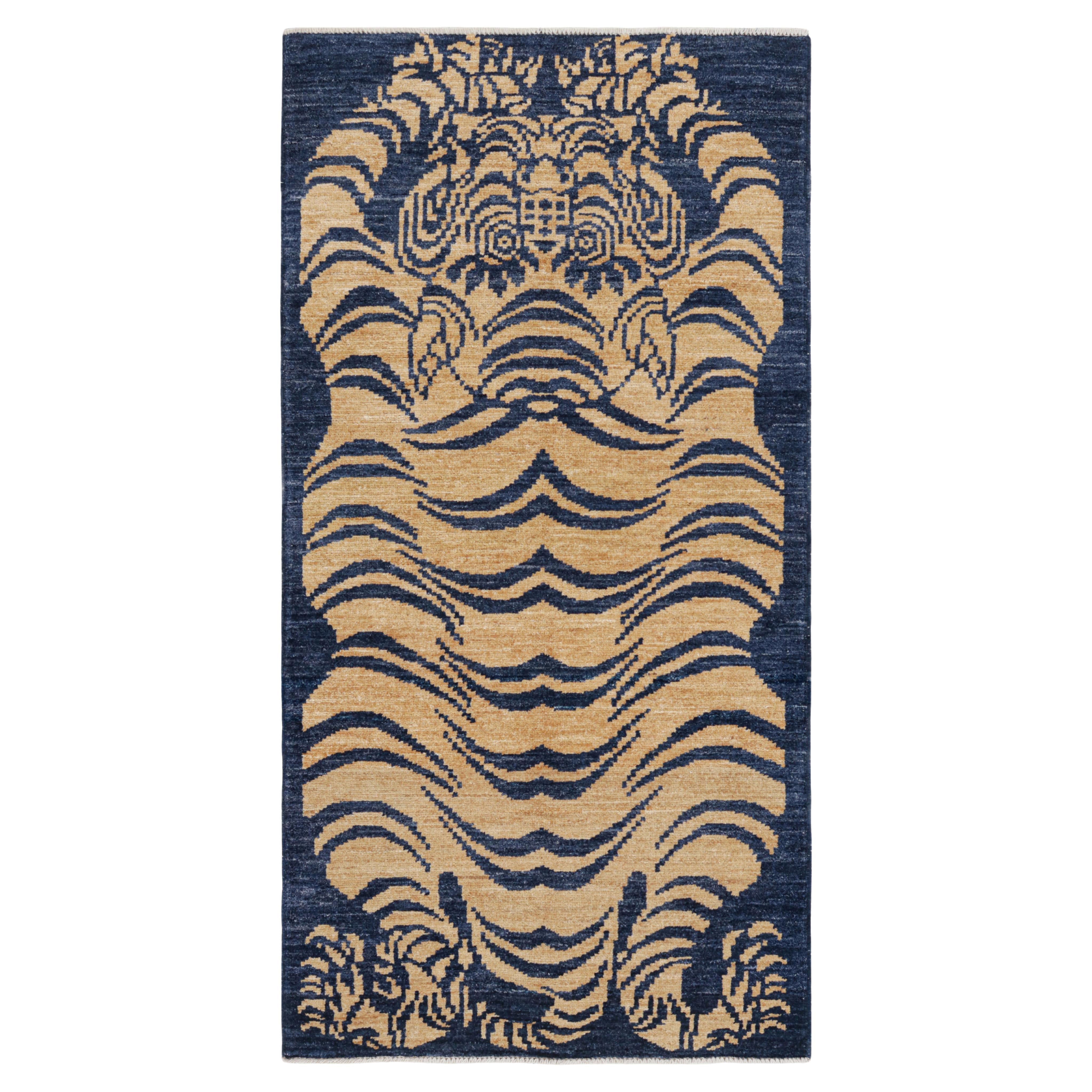 Rug & Kilim’s Contemporary Tiger Skin Runner Rug in Navy Blue & Gold Pictorial
