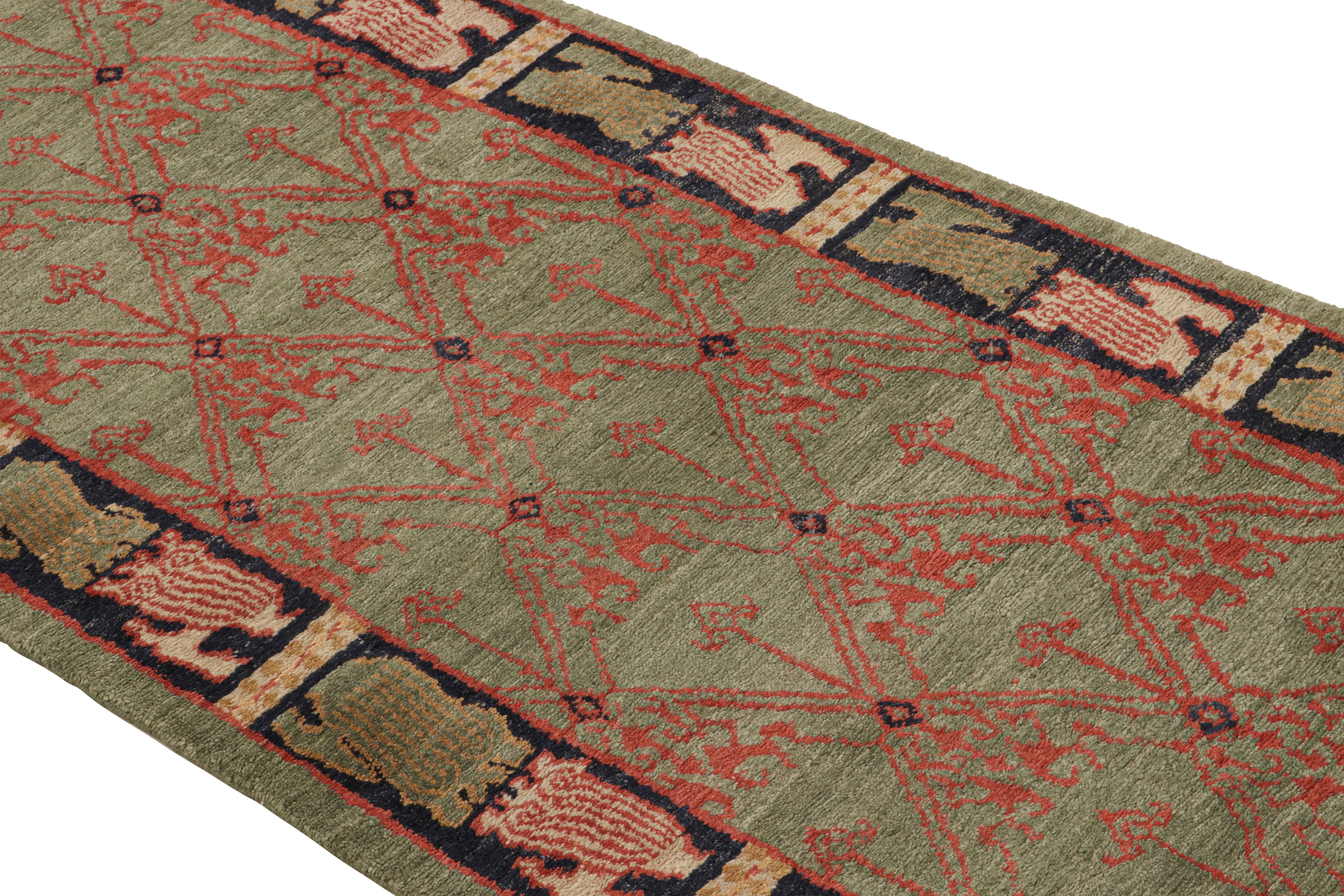 Hand-knotted in Nepal with high-quality wool, this traditional Cortex runner hosts a visually inviting array of abrash green and tangerine red colorways, complemented by a finely woven geometric field pattern and a series of ornate curvilinear black