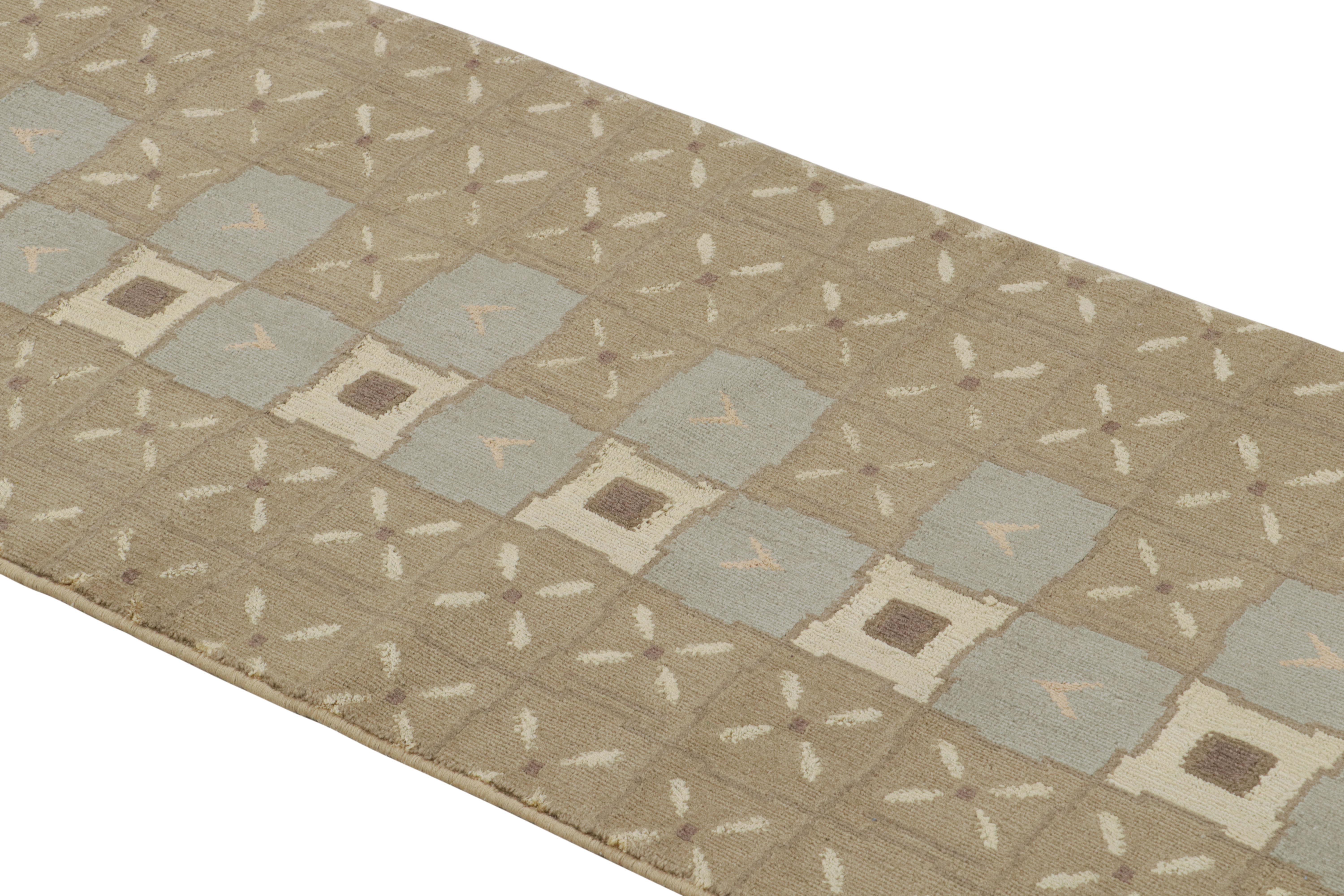 Hand knotted in Nepal featuring durable wool and silk body, this contemporary Orendi rug marries many inviting geometric influences, including tiled patchwork designs present in the rippling field as well as Turkish open-field borders, mirrored in