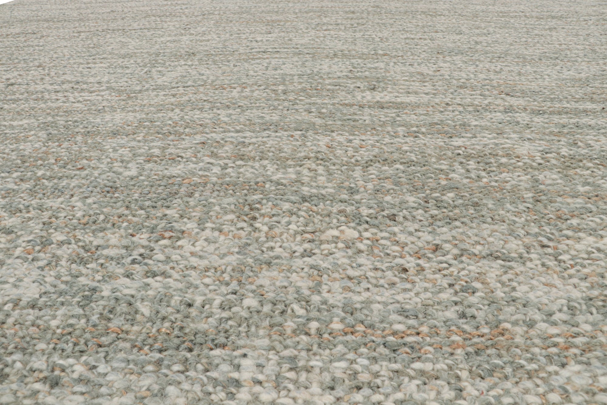 This 9x12 flatweave in contemporary design belongs to Rug & Kilim’s brand new collection - all handwoven in jute.

On the Design:

The kilim rug enjoys a tasteful boucle-like texture and sense of movement for a more modern take on plain rugs. A keen