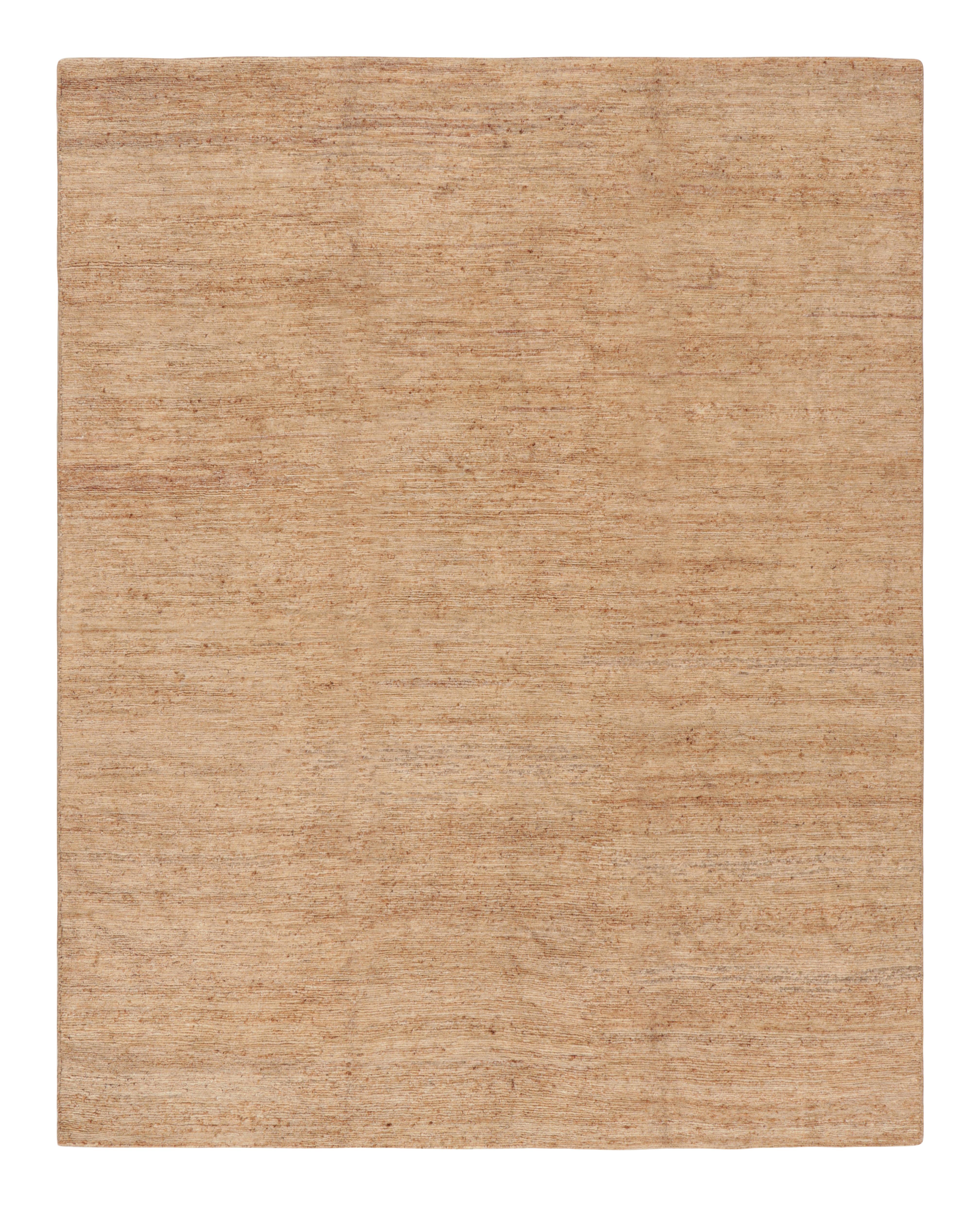 Questo tappeto testurizzato 8x11 di Rug & Kilim è un'entusiasmante novità della sua collezione Texture of Color, realizzata con iuta annodata a mano e caratterizzata da strisce e striature beige-marrone e rame tra altre tonalità neutre e toni della