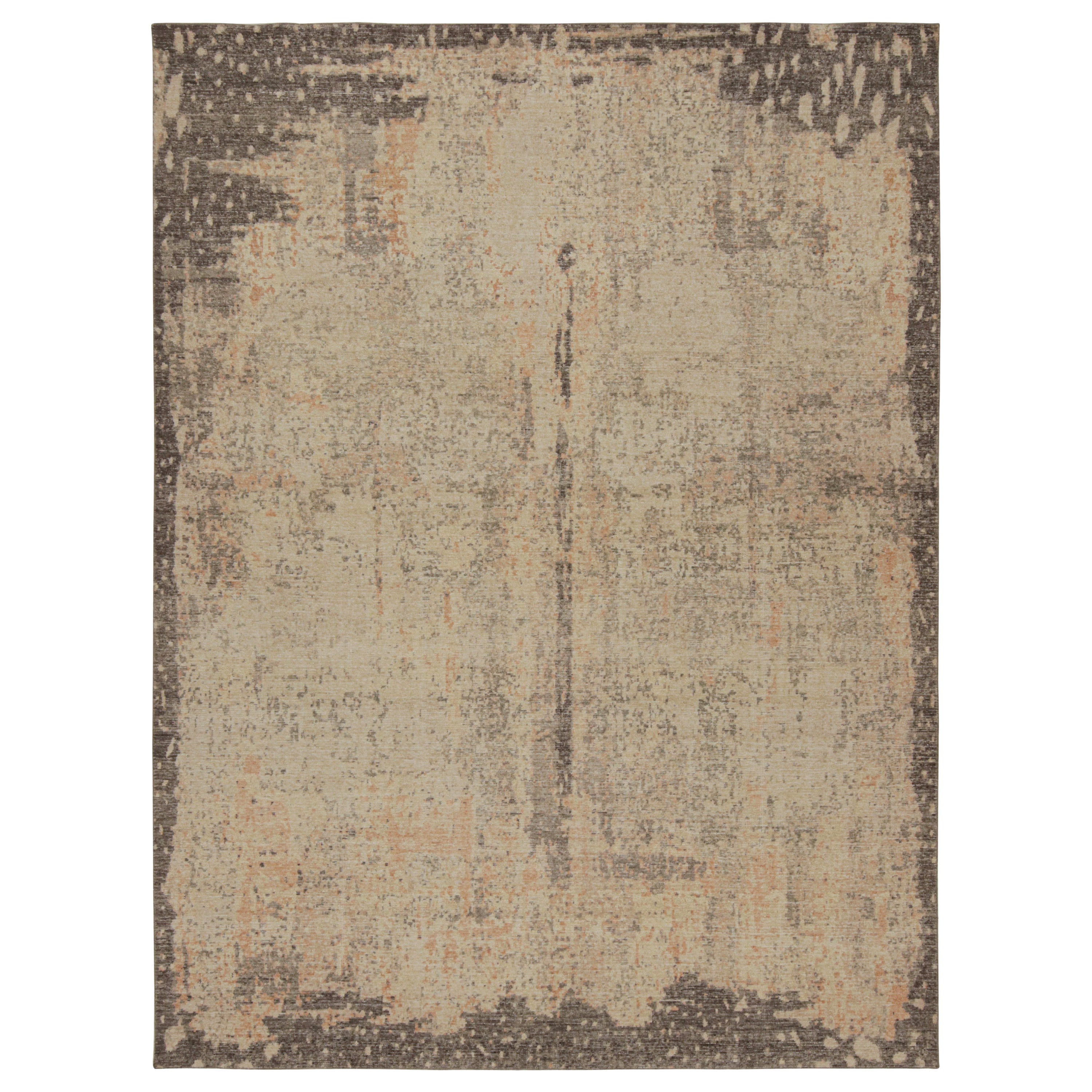 Rug 
Kilim è un tappeto astratto e danneggiato con motivi beige e grigi.