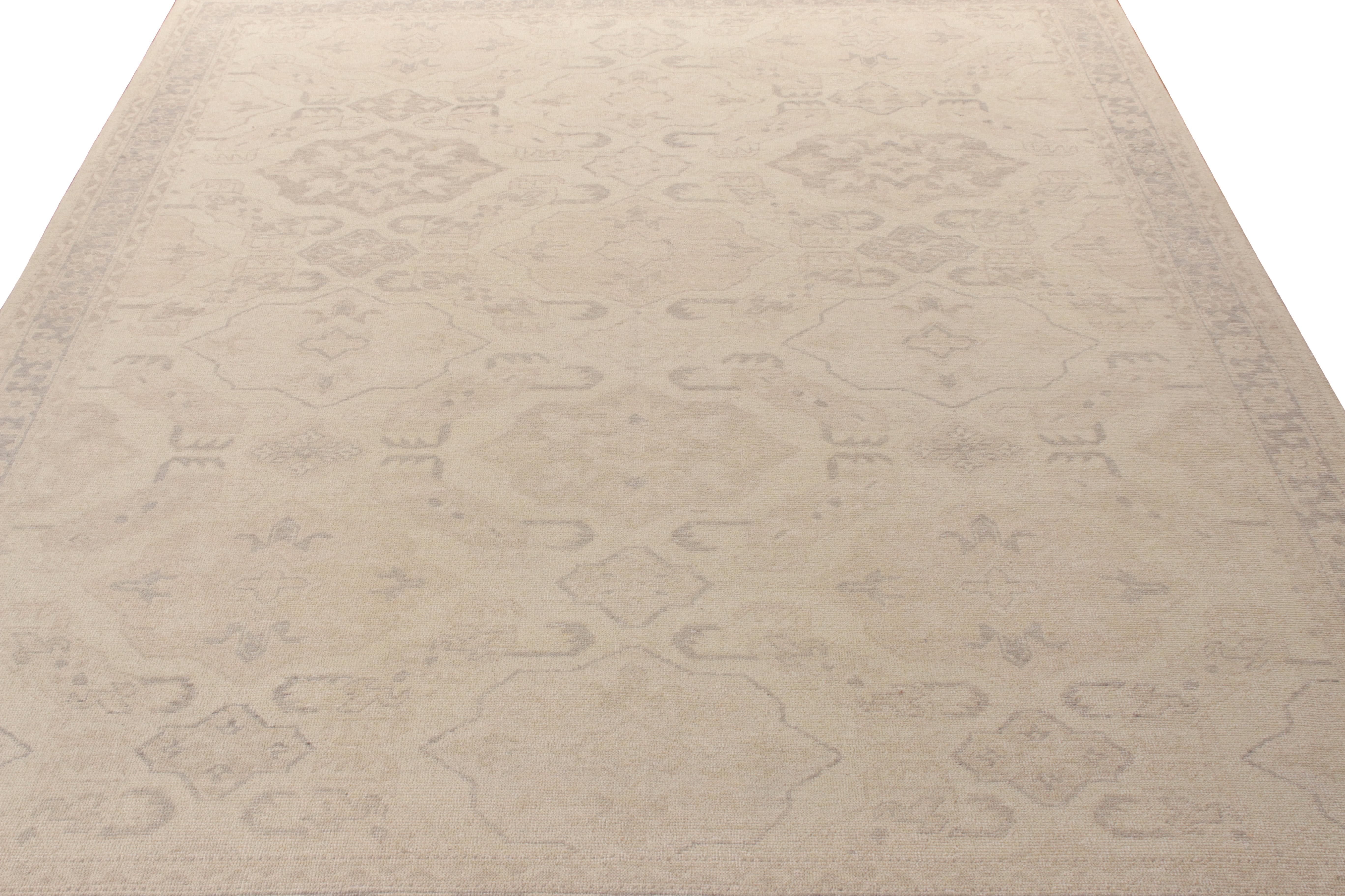 Hand knotted in wool with tastefully muted shades of beige and gray-purple, Rug & Kilim boasts this 9x12 rug from its Homage Collection. Featuring a meticulous geometric-floral pattern, the rug exemplifies a modern textural approach to a distressed