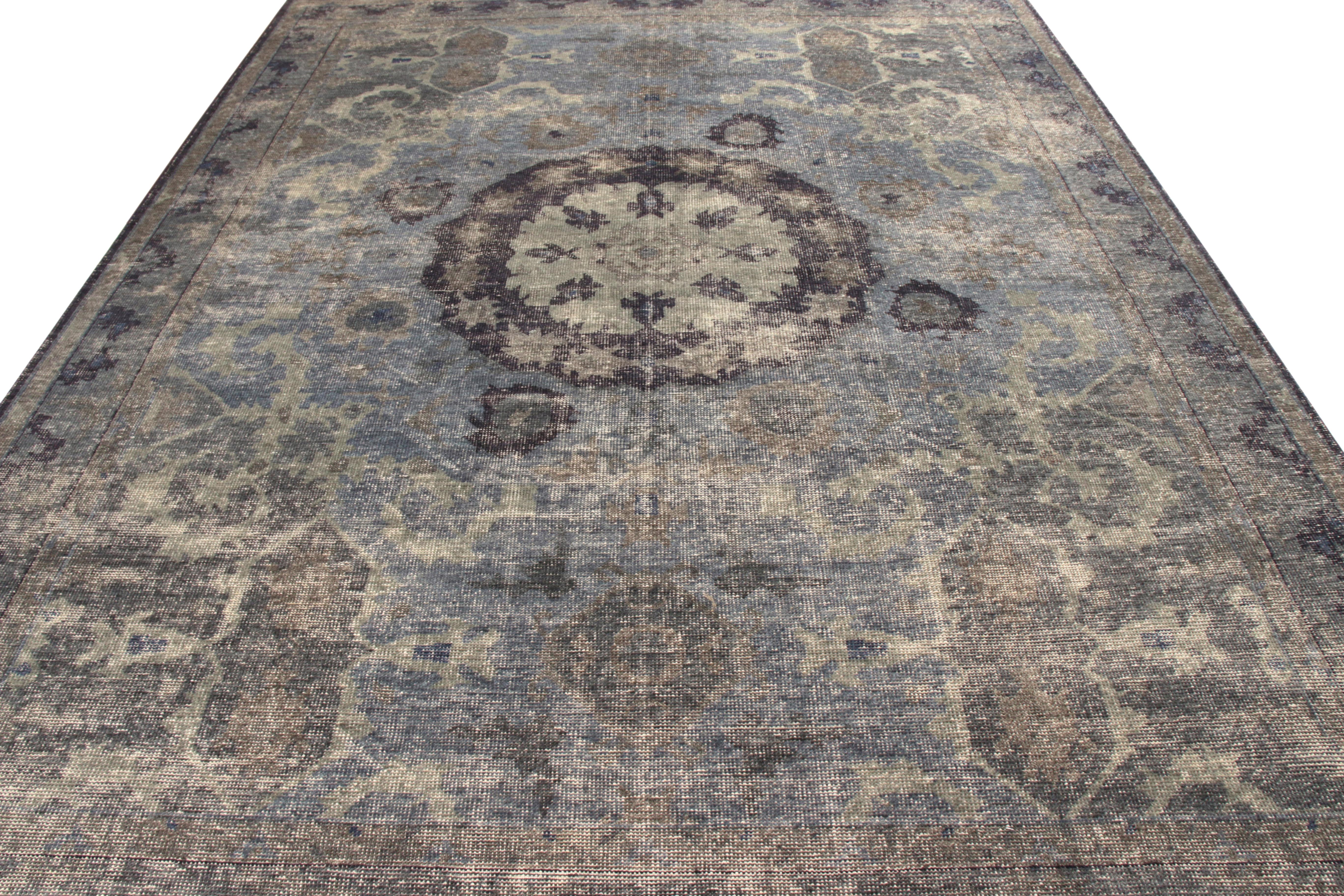A 9 x 12 ode to celebrated Oriental rug styles, from the classic selections in Rug & Kilim’s Homage Collection. Hand knotted in wool with a shabby-chic, distressed texture, enjoying a sophisticated medallion style in blue and gray. The play of these