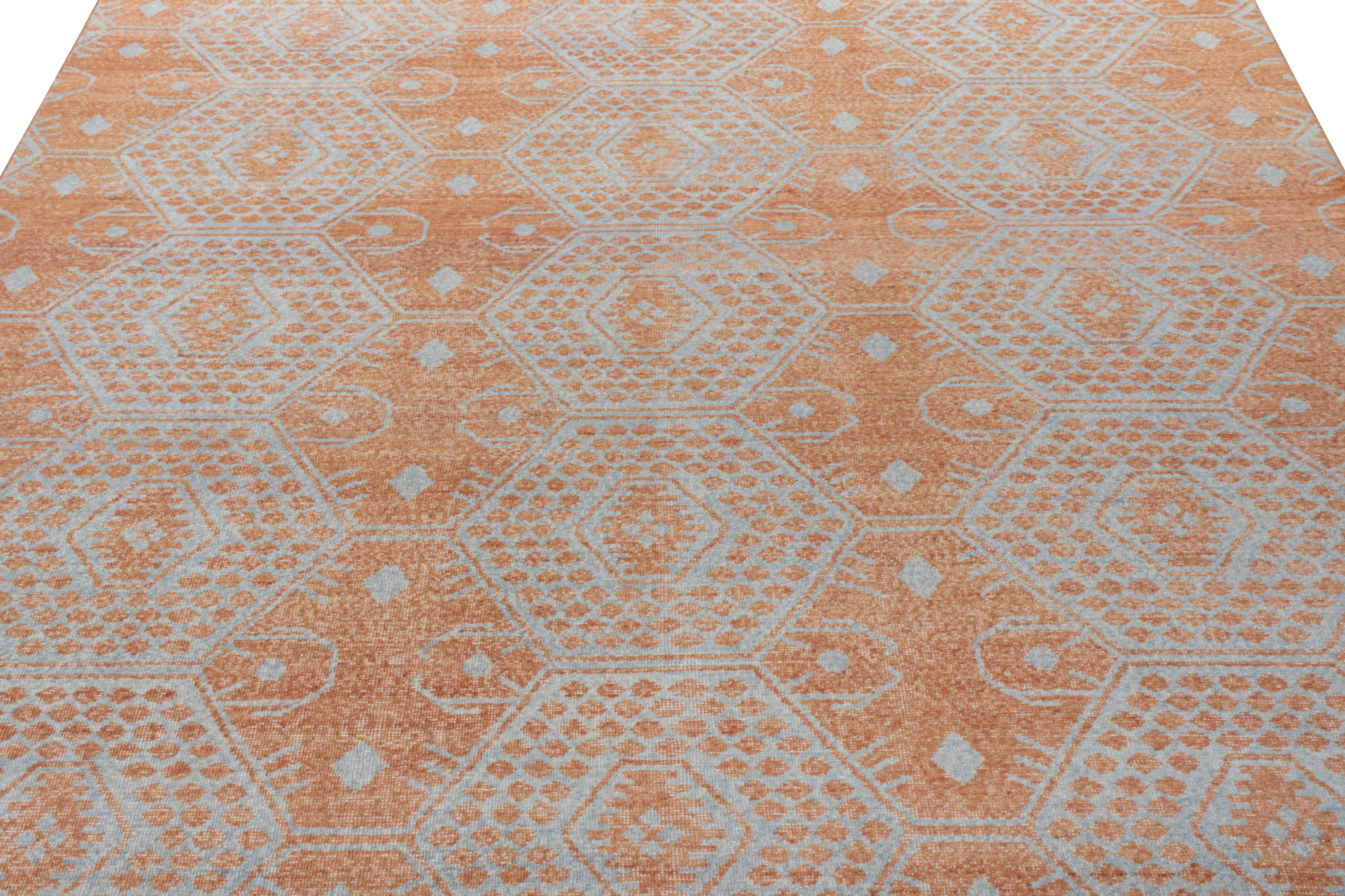 Boasting a seamless geometric pattern in an enticing orange and blue colorway, this piece from Rug & Kilim’s Homage collection succeeds in attracting the eye with its distressed textural style and balance in color. A 9x12 hand-knotted wool piece,