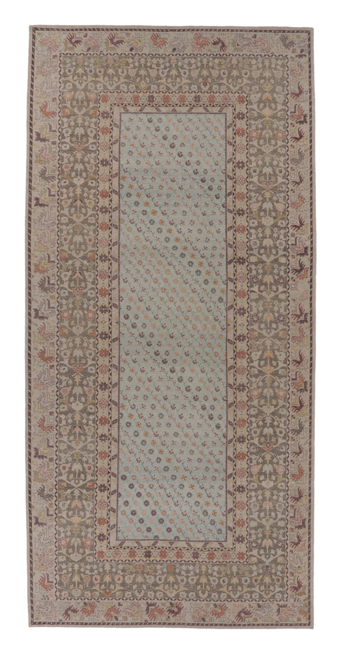 Rug & Kilim’s Distressed Custom Oversized Rug in Light Blue with Floral Patterns
