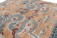 Rug & Kilim’s Distressed Dragon Rug in Blue, Gold and Red Pictorial Patterns