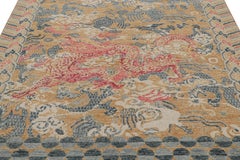 Rug & Kilim’s Distressed Dragon Rug in Blue, Ochre and Red Pictorial Patterns