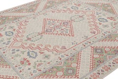 Rug & Kilim’s Distressed Ghiordes Style Rug in Cream, Green, and Red with Medall