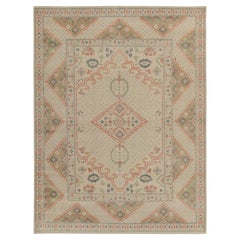 Rug & Kilim’s Distressed Ghiordes Style Rug in Greige, Green, Red Medallion