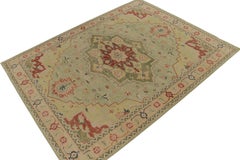 Rug & Kilim’s Distressed Heriz-Serapi Style Rug in Green, Pink & Red Medallion