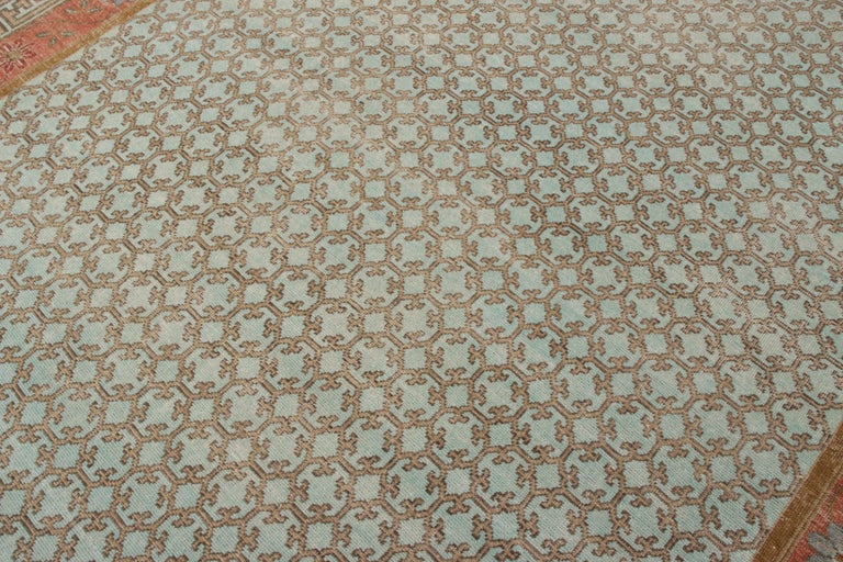 Rug and Kilim’s Distressed Khotan Style Rug in Blue and Orange