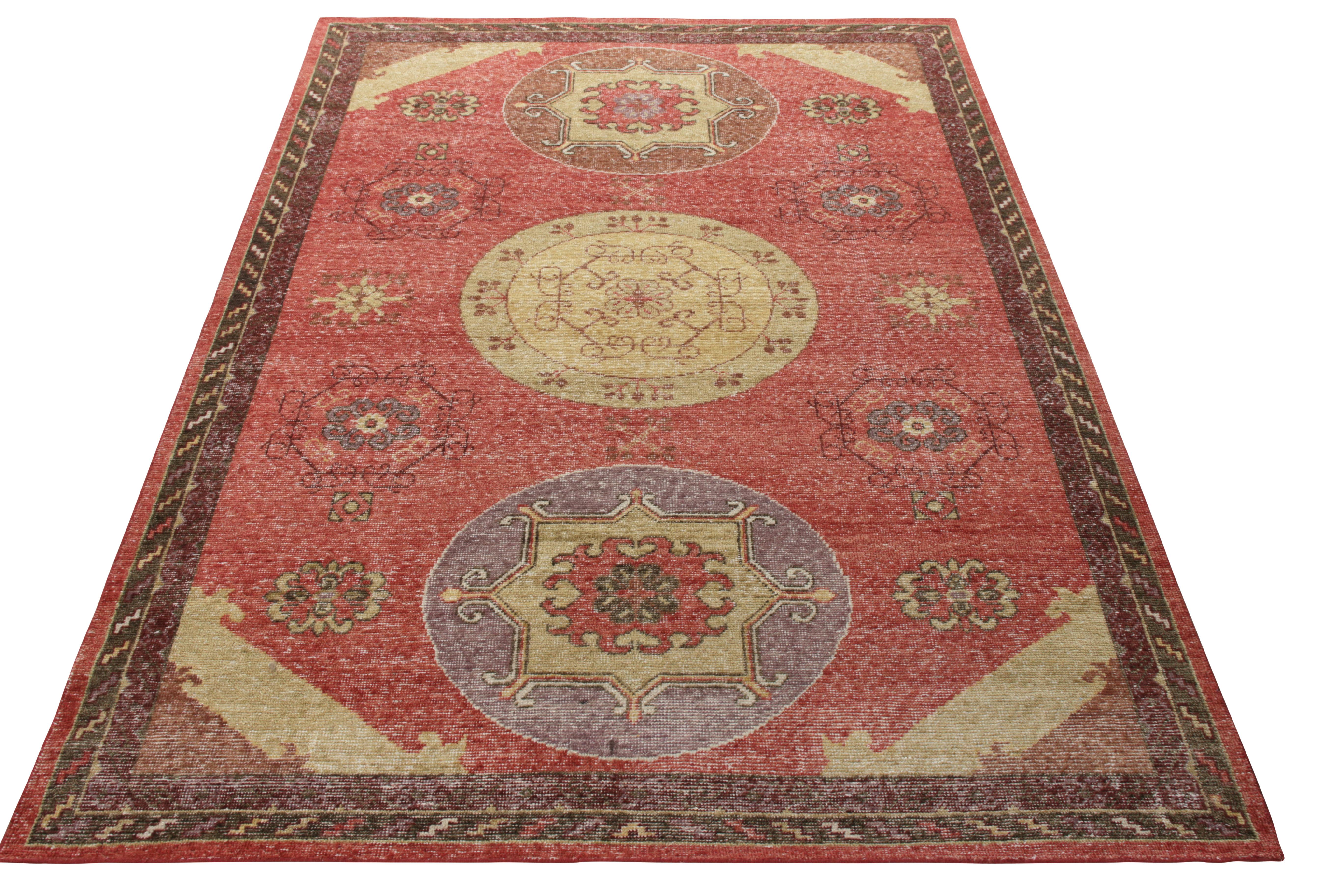 A 6x9 distressed style Khotan-inspired rug from Rug & Kilim’s Homage Collection. Carrying an enticing medallion pattern, this hand-knotted wool rug revels in a rich and bright color palette of beige-brown, off-yellow and red that witnesses elements