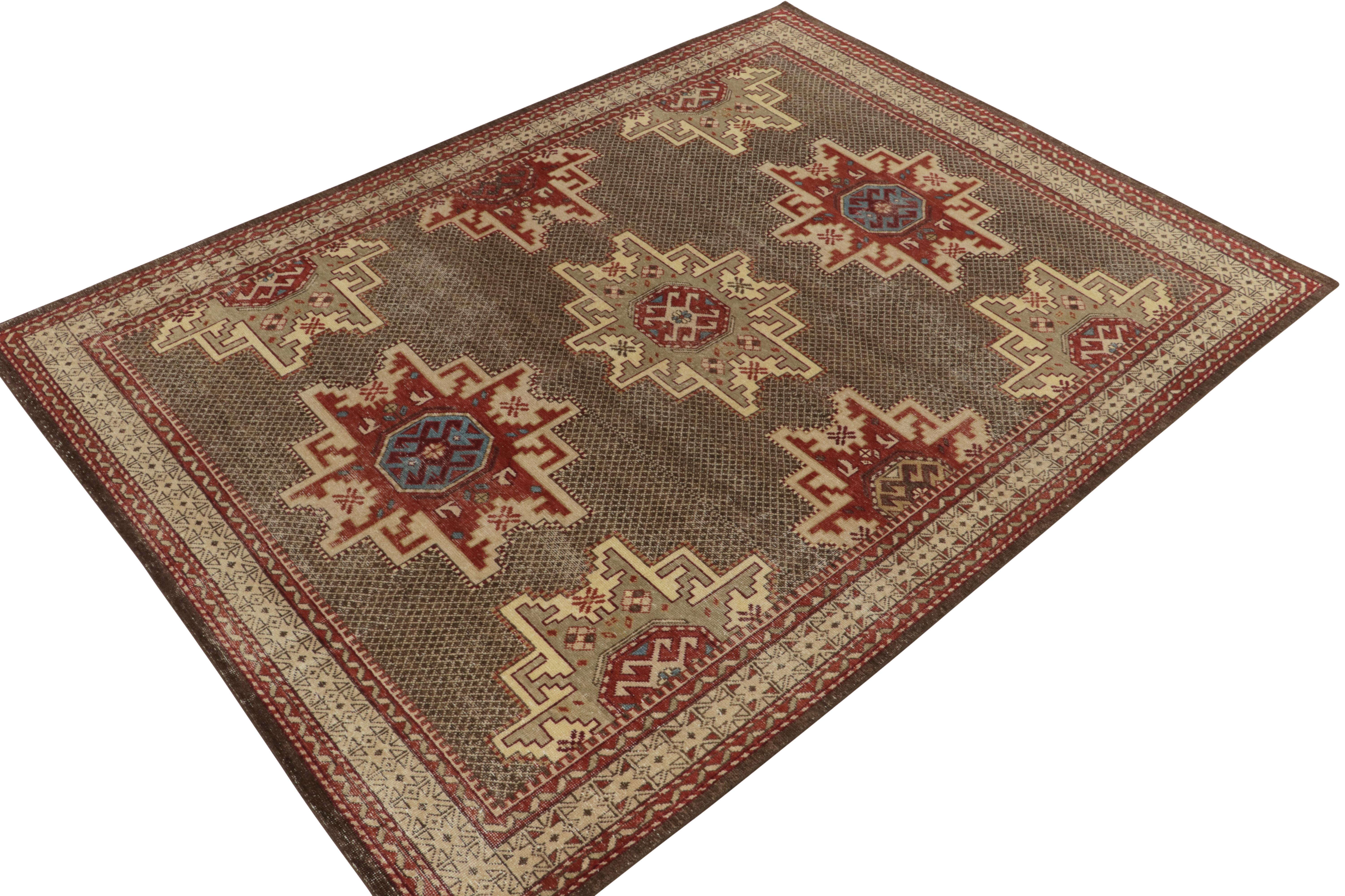 From Rug & Kilim’s Homage collection, a 9x12 distressed style tribal rug inspired from the celebrated Caucasian Kuba style. Hand-knotted in wool, the rustic vision preaches tradition with tribal patterns engulfing the connoted Lesghi star motif in