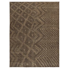 Rug & Kilim è un tappeto in stile marocchino con motivi geometrici beige e marroni.