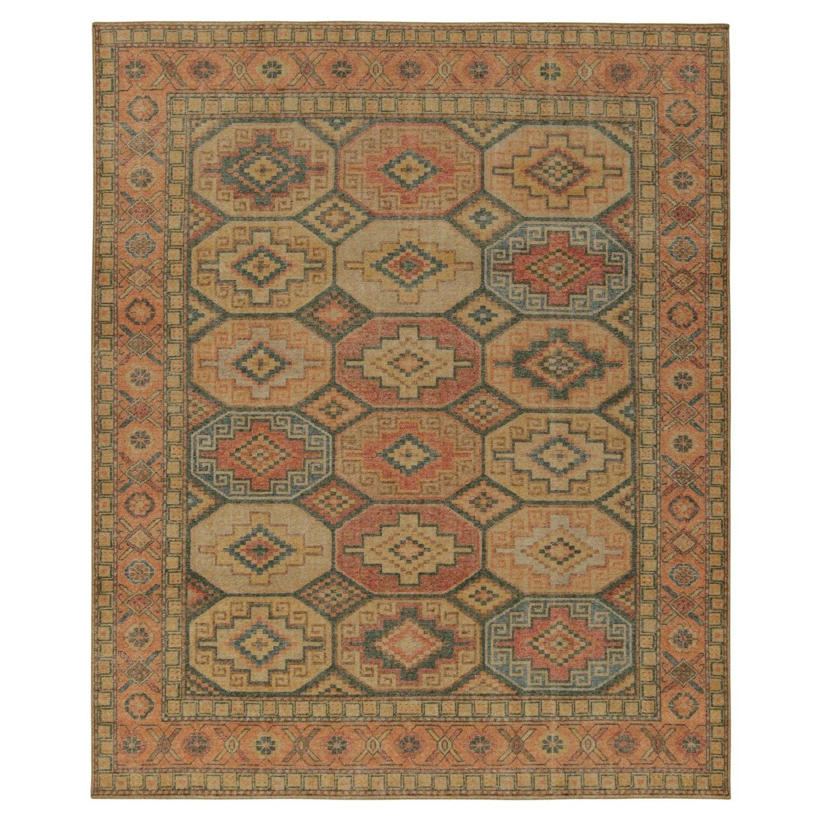 Rug & Kilim’s Distressed Persian Style Rug in Orange, Beige and Blue Medallions