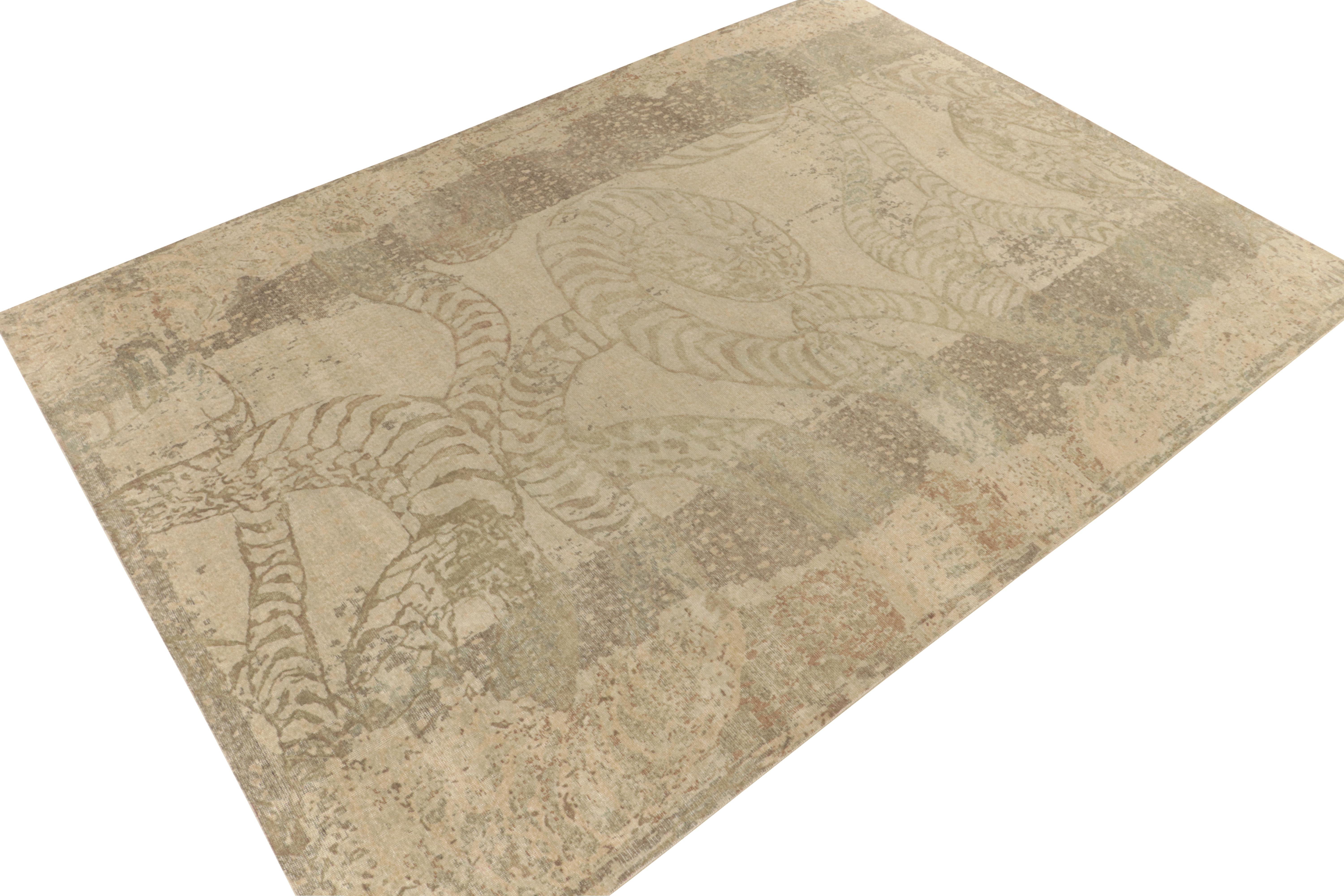 From Rug & Kilim’s Homage collection, a 10x14 distressed style abstract rug relishing a forgiving play of beige-brown and gray for a comfortable allure. Inspired by abstraction of animal skin rugs, the vision enjoys subtlety of color playing